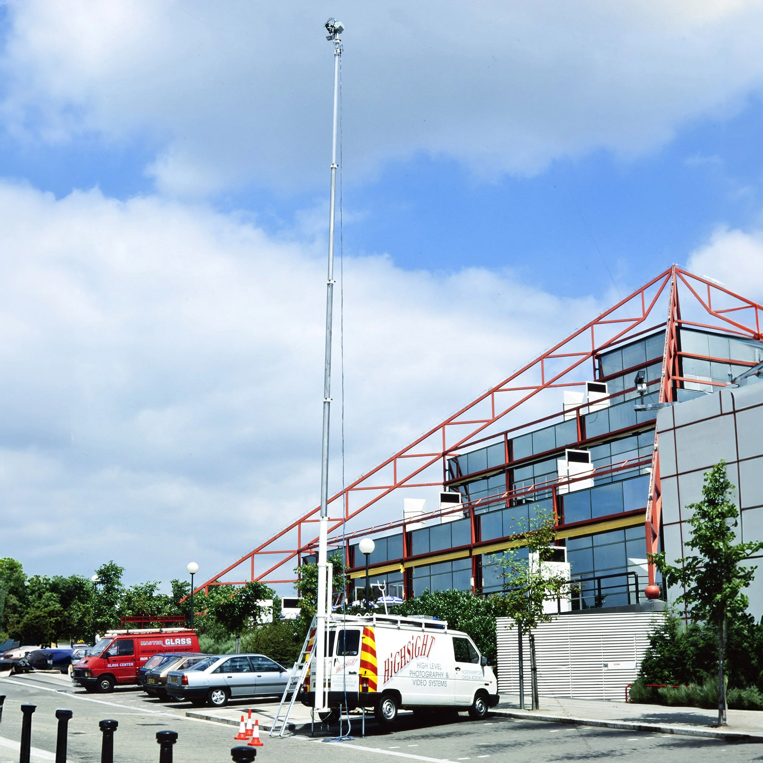 Charles Ward Photography's HighSight vehicle at Milton Keynes Point in the early 1990s. The HighSight vehicle was fitted with an 80ft telescopic mast, with a remote controlled Mamiya RZ camera and was used to take elevated photographs before drones