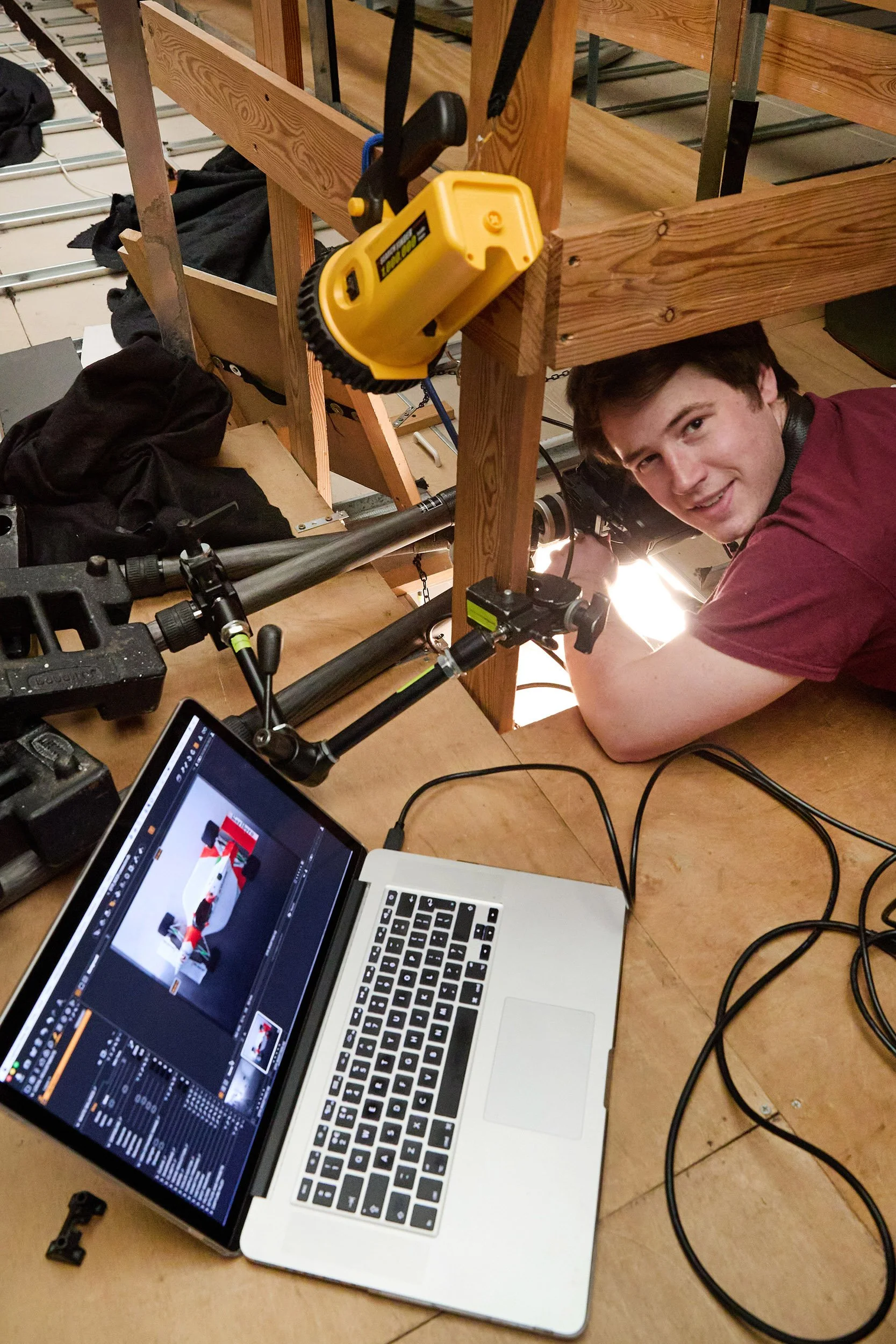 James Ward carrying out a vertical photoshoot at Junction Eleven Studios. The car is positioned directly beneath this hatch in the roof, allowing the photographer to take a perfectly overhead image.
