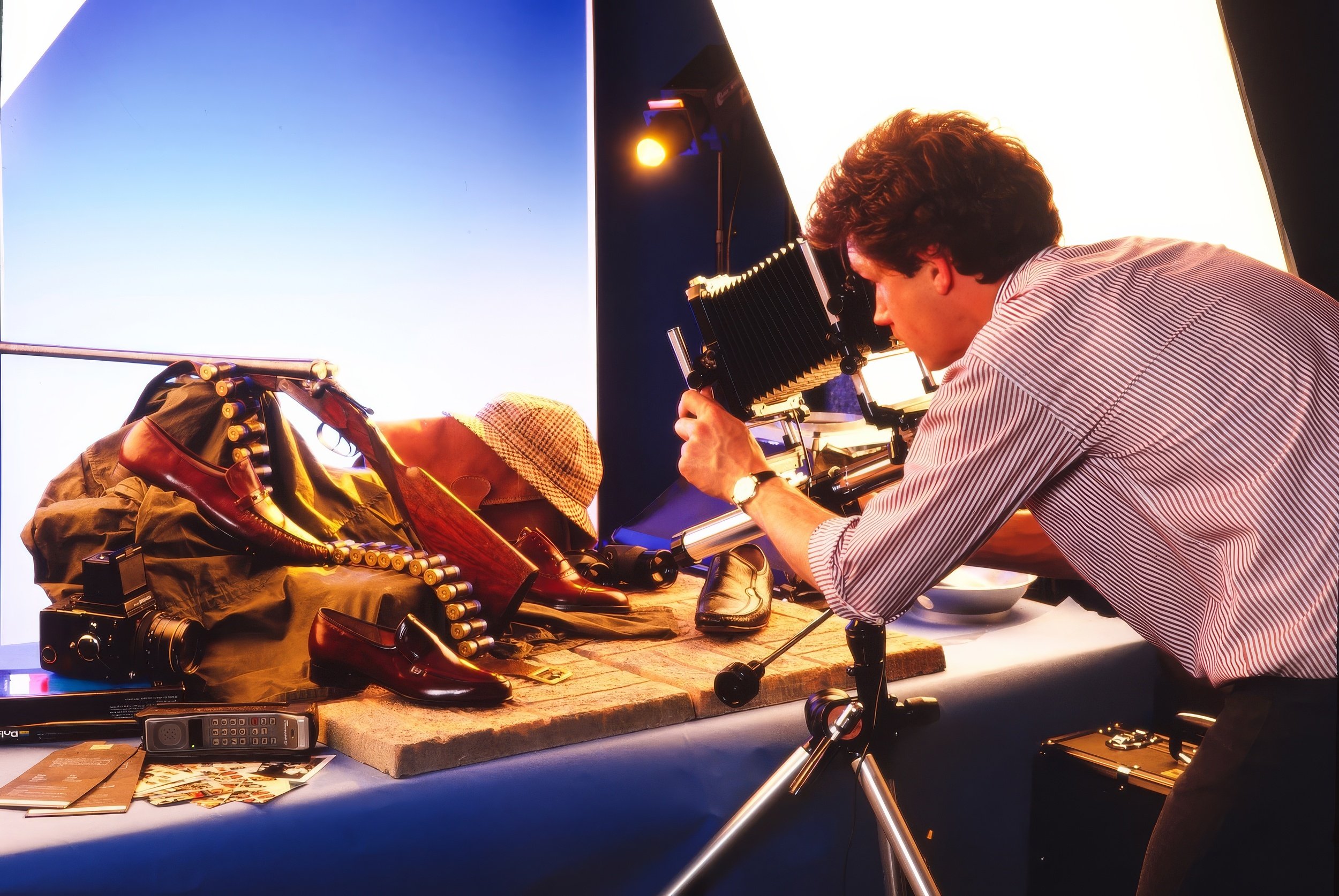 Charles Ward taking photographs of barker shoes in his Earls Barton studio back in 1985. Charles is using a Toyo 5x4 film camera 