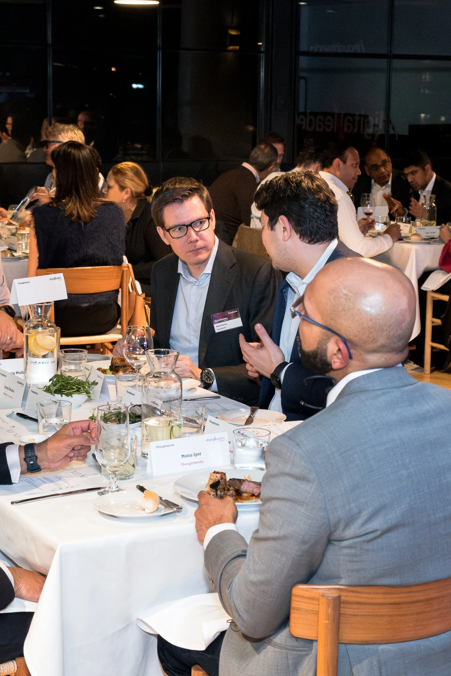 Mid conversation in corporate networking dinner in Sydney