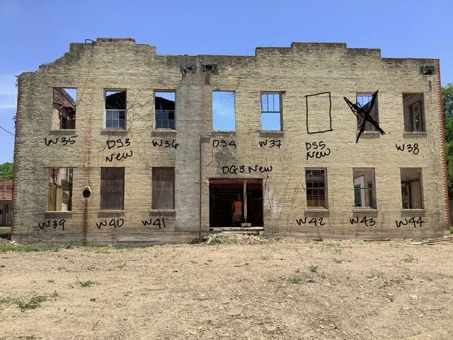 Martindale Motor Corporation Building before rehabilitation with missing windows and roof damage