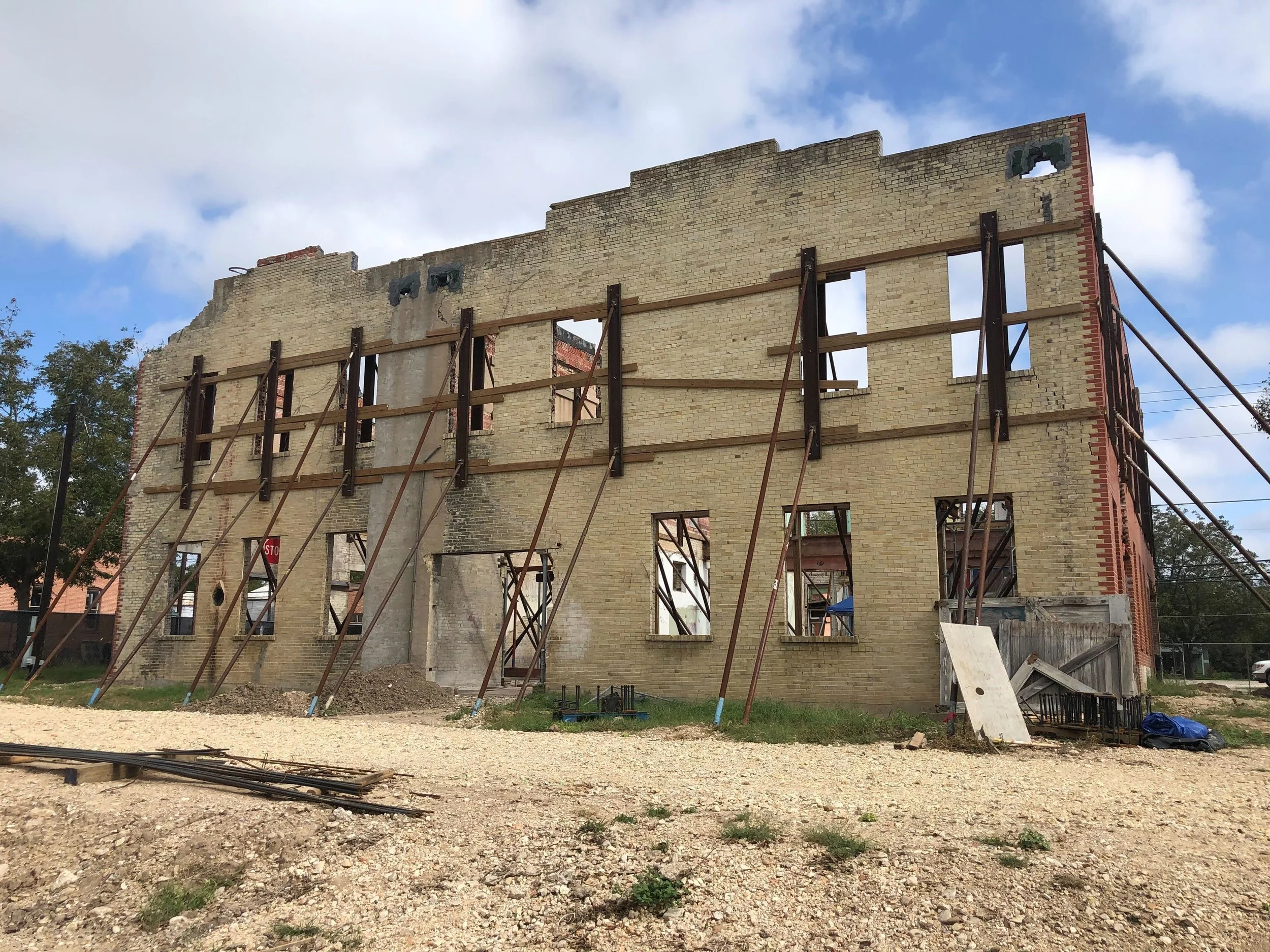 Martindale Motor Corporation Building before rehabilitation with missing windows and roof damage