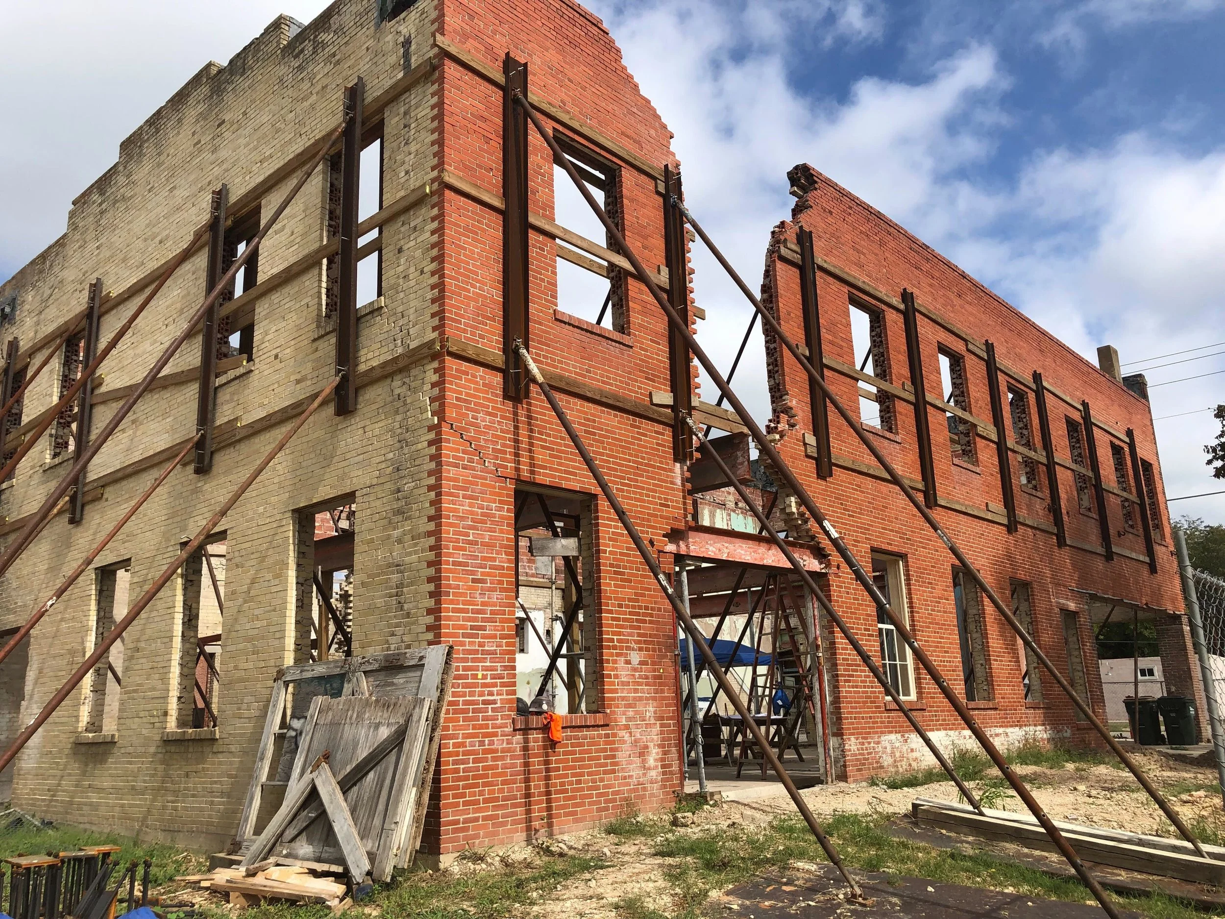 Martindale Motor Corporation Building before rehabilitation with missing windows and roof damage