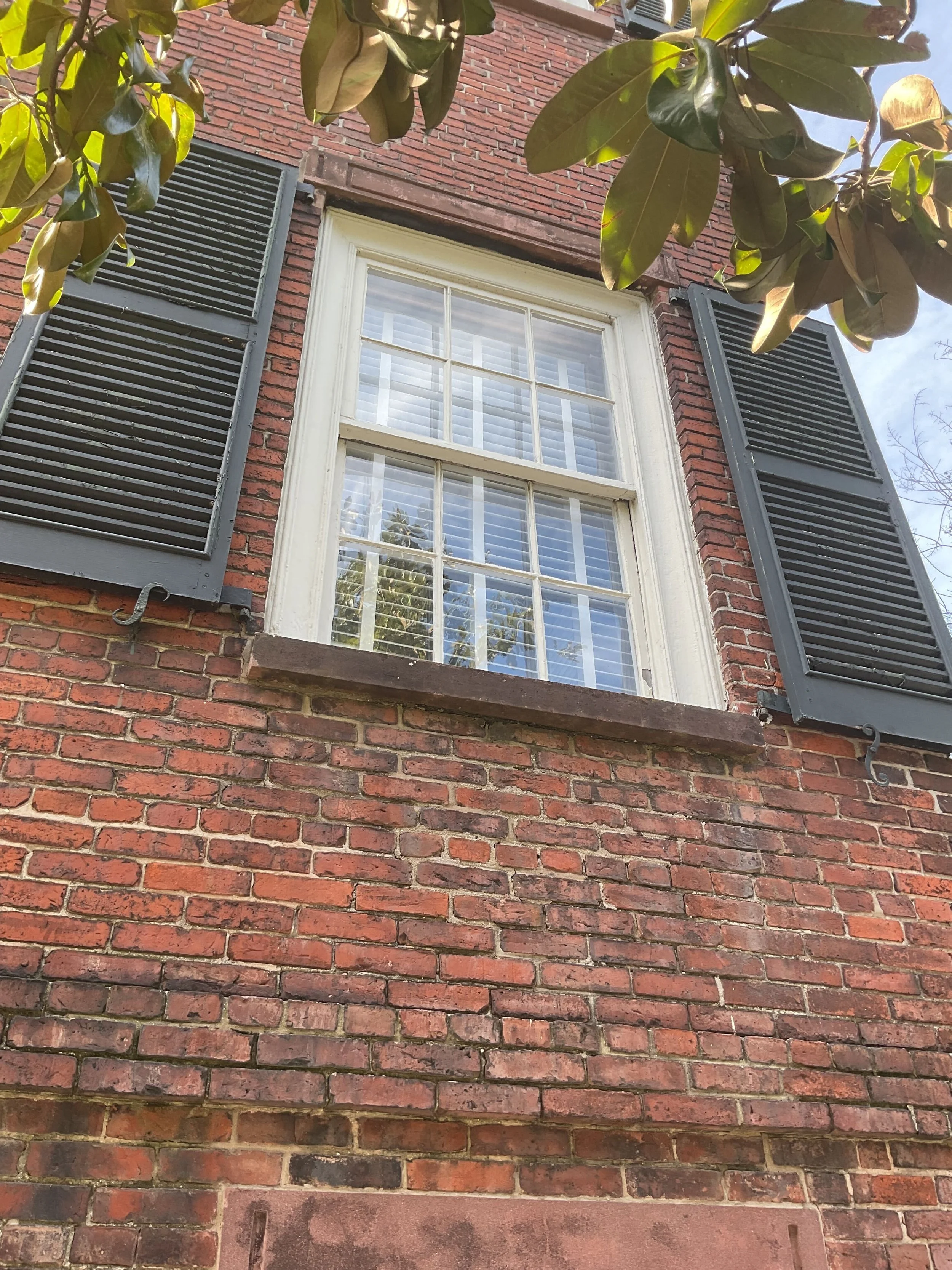 Historic wood window and shutters on The Davenport House Museum in Savannah GA owned by the Historic Savannah Foundation