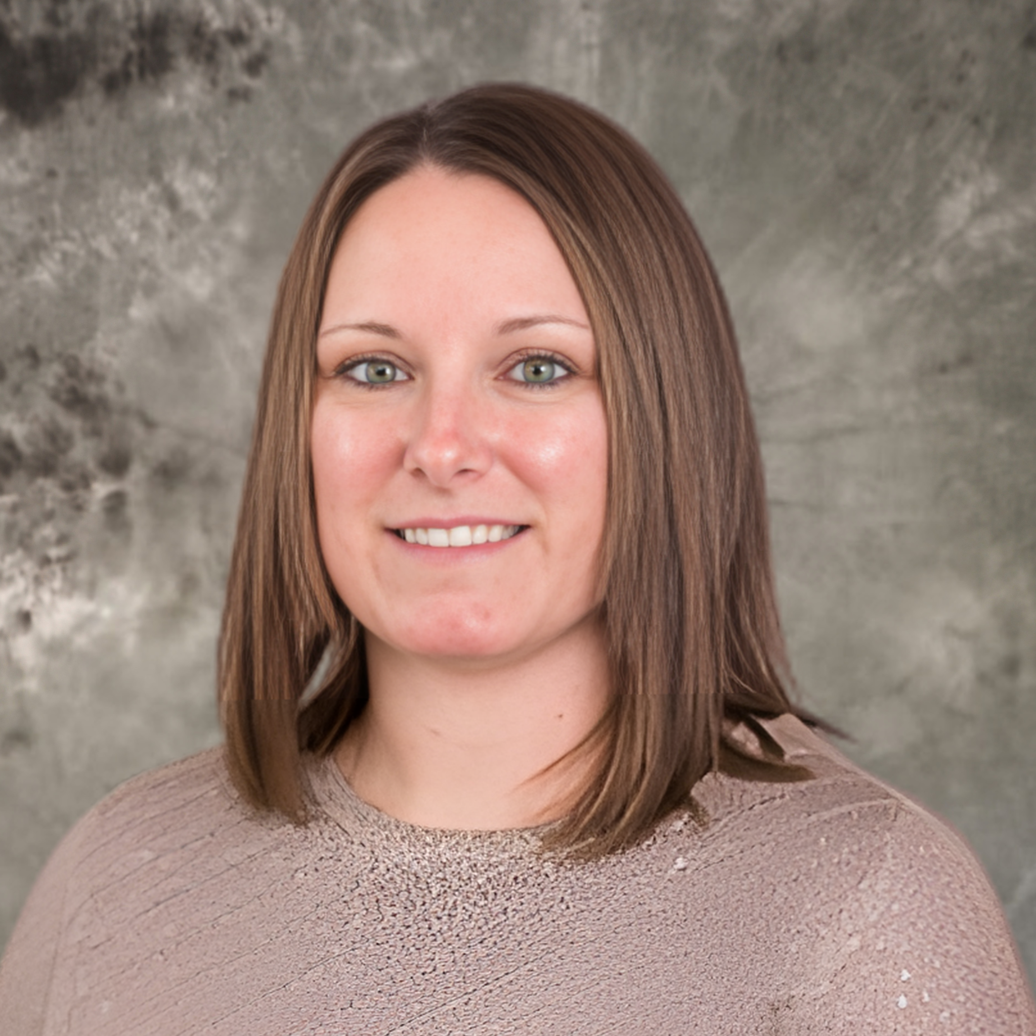 A headshot of a brunette woman.