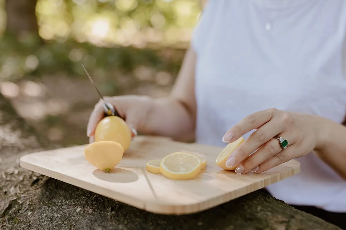 A woman cutting lemons
