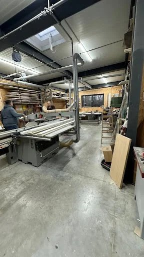 Woodworking shop interior with tools and materials