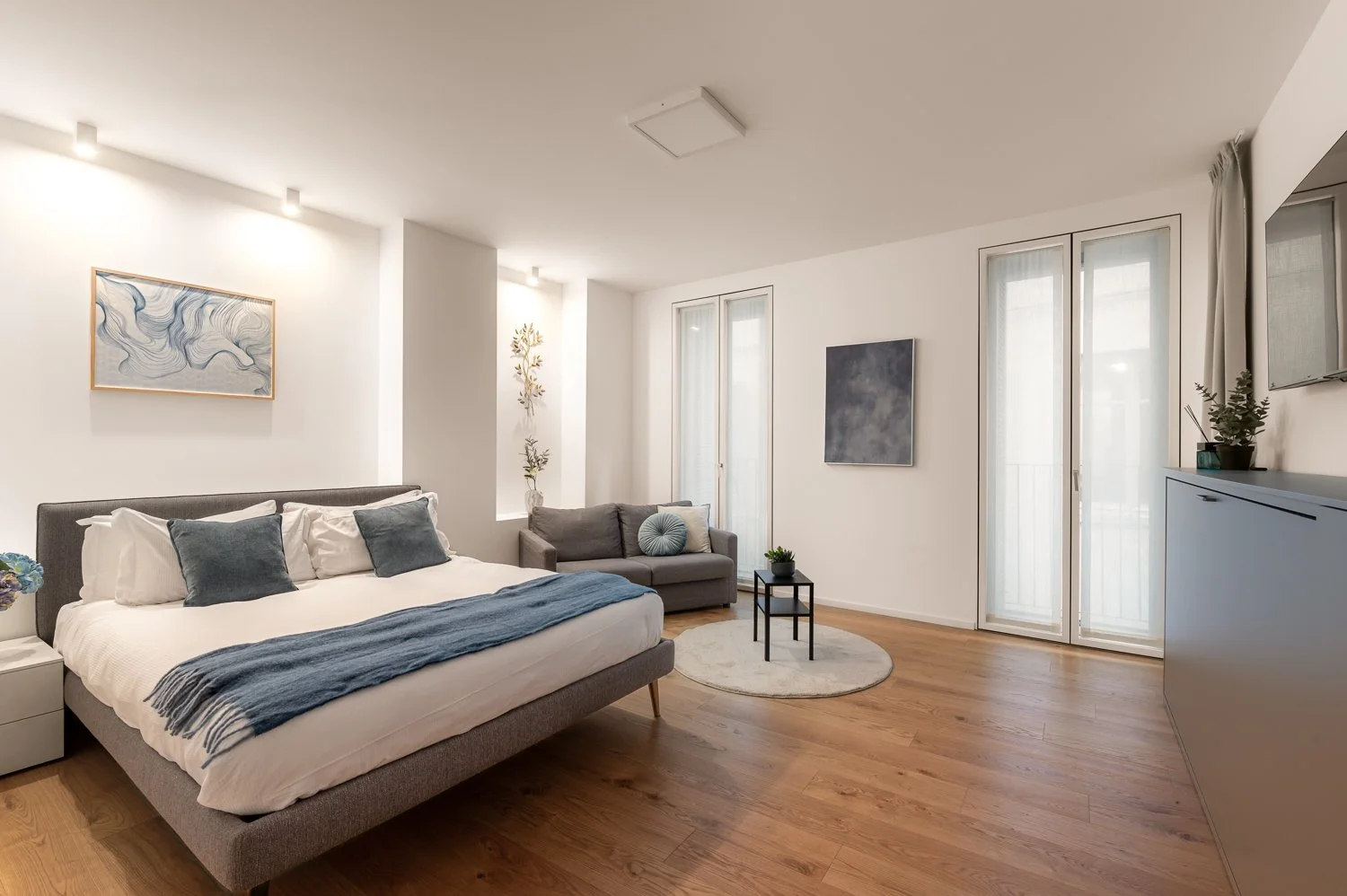 The Golden Studio sleeping area — intimate luxury apartment Como Italy