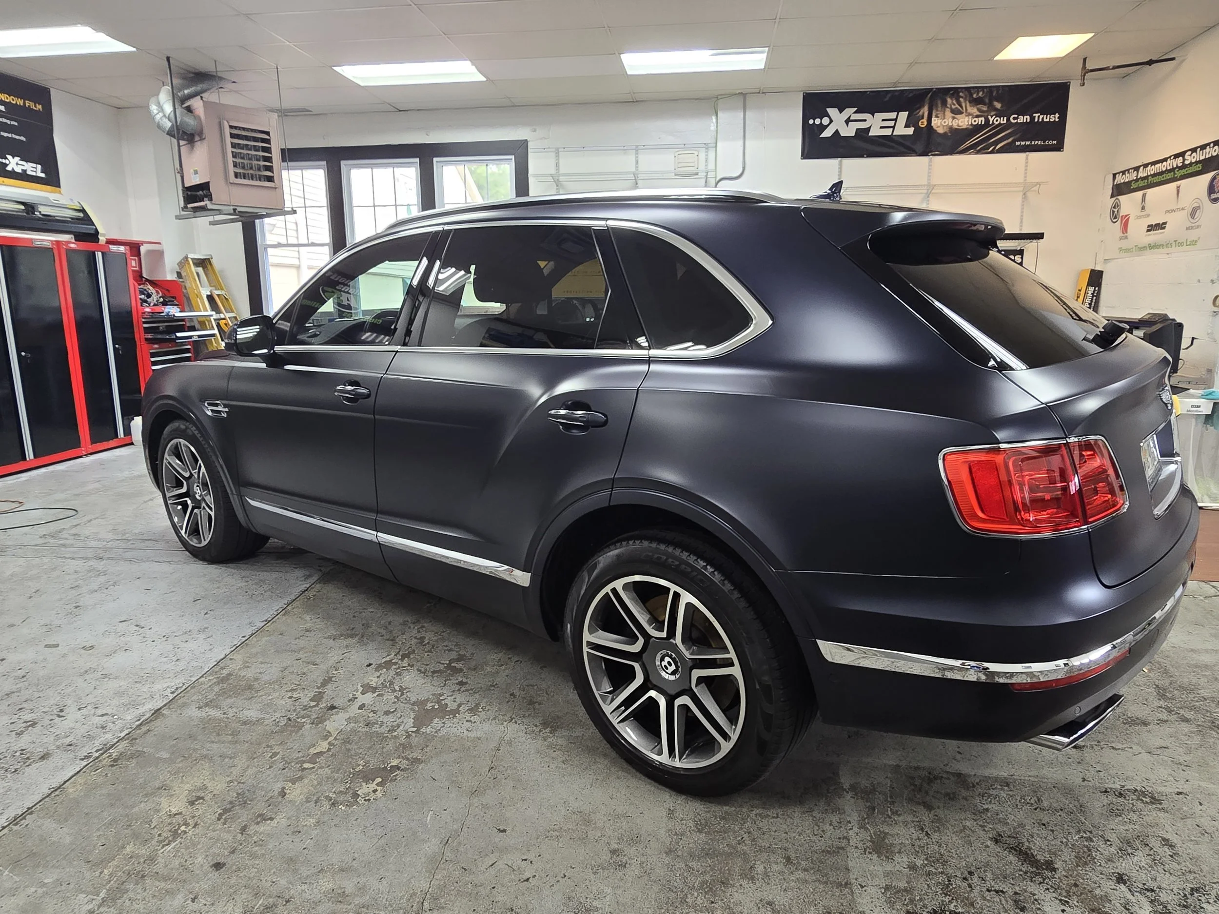 Black matte finish luxury SUV Fully Wrapped in XPEL Stealth Film