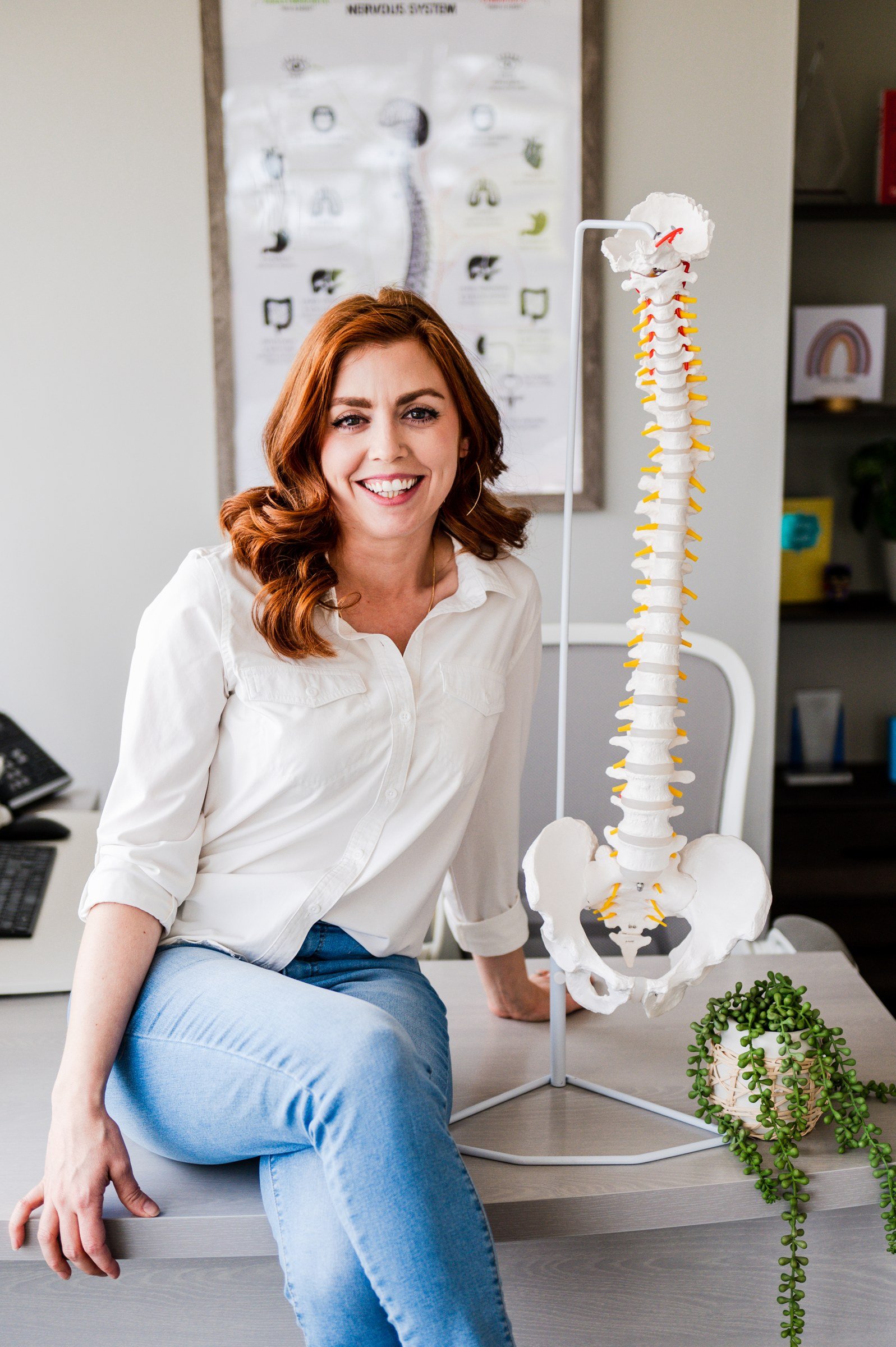 Dr. Shannon Bundy with a spine model, spinal correction at The Wellness Way Westminster