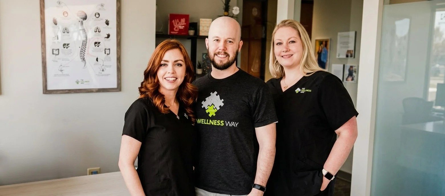 The Wellness Way Westminster team - Dr. Shannon Bundy, Zach and LynDee at the clinic front desk