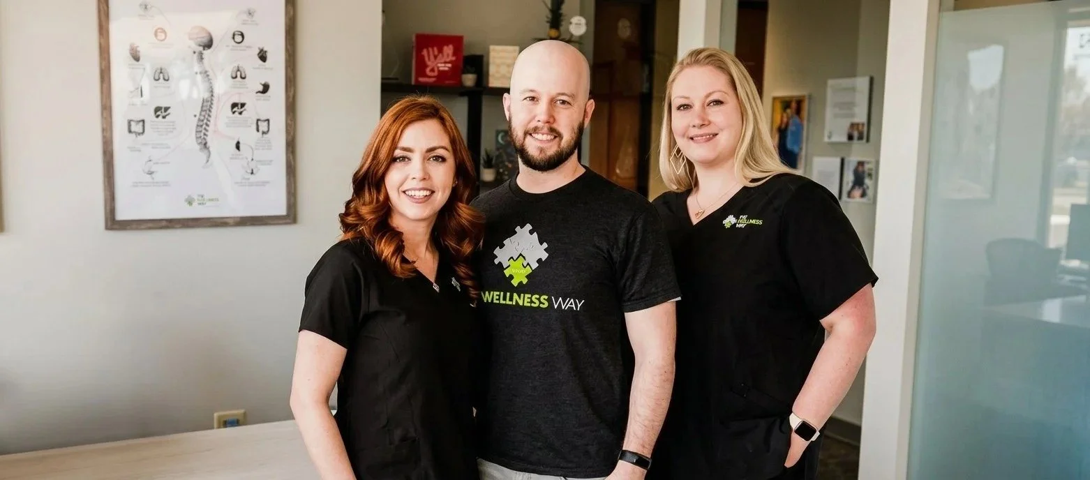 The Wellness Way Westminster team - Dr. Shannon Bundy, Zach and LynDee at the clinic front desk