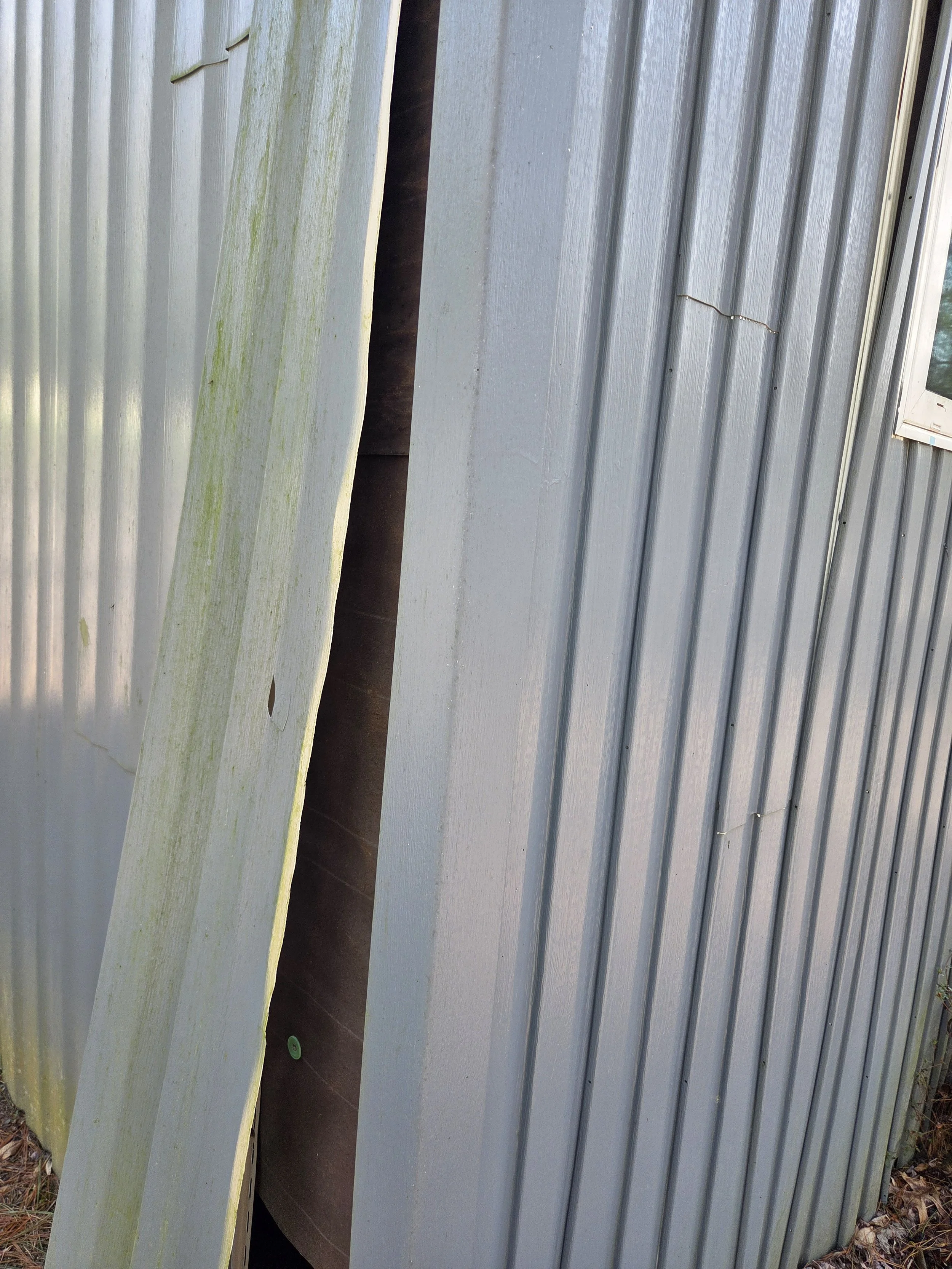 The siding to the addition to a mobile home. This is horizontal siding installed in a vertical manner. The edges were not secured and all of this allowed water to migrate into the home and rot surfaces.