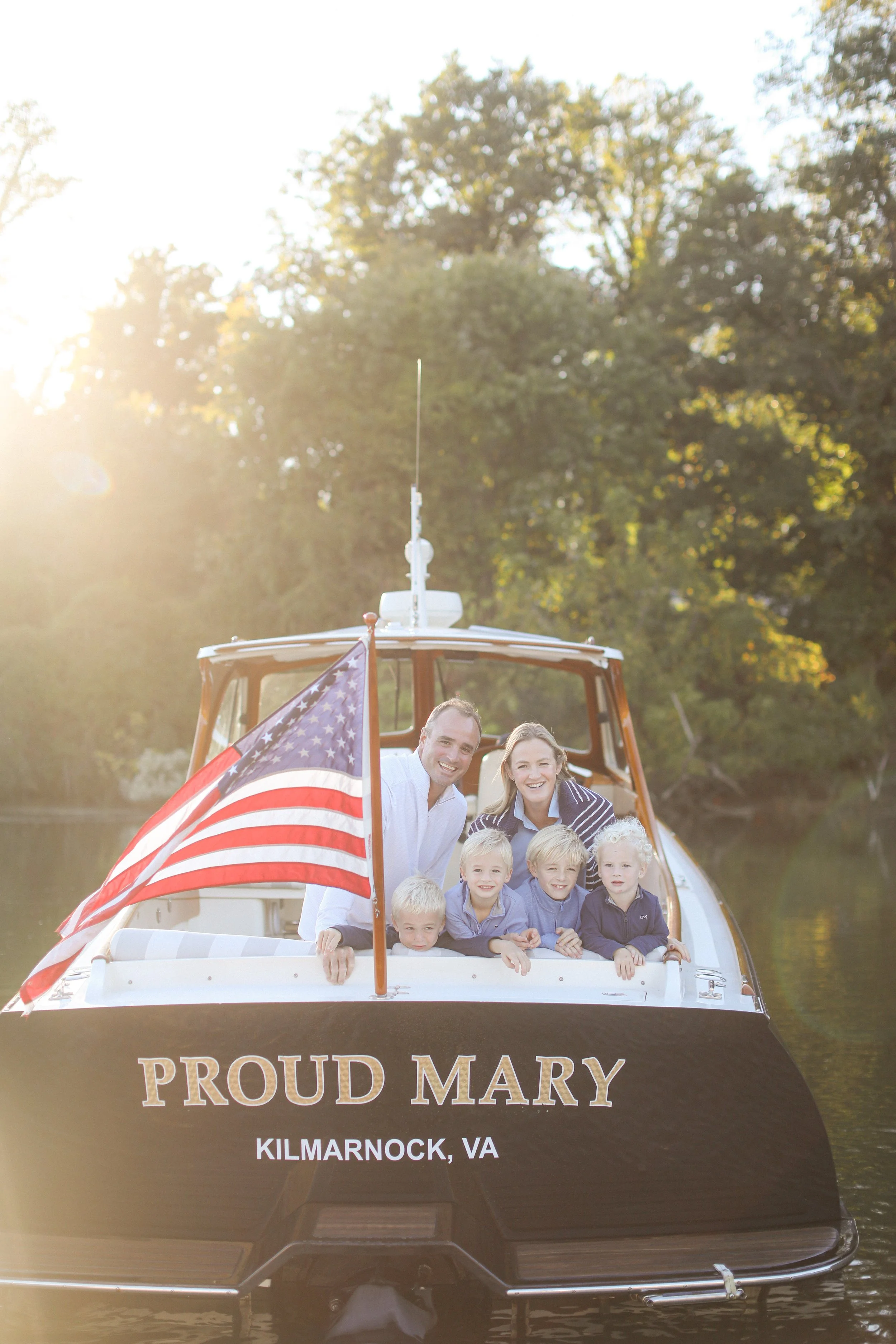 Family enjoying a luxury sunset charter aboard a Hinckley Picnic Boat with Chesapeake Classic Yacht Charters in Annapolis, MD 
