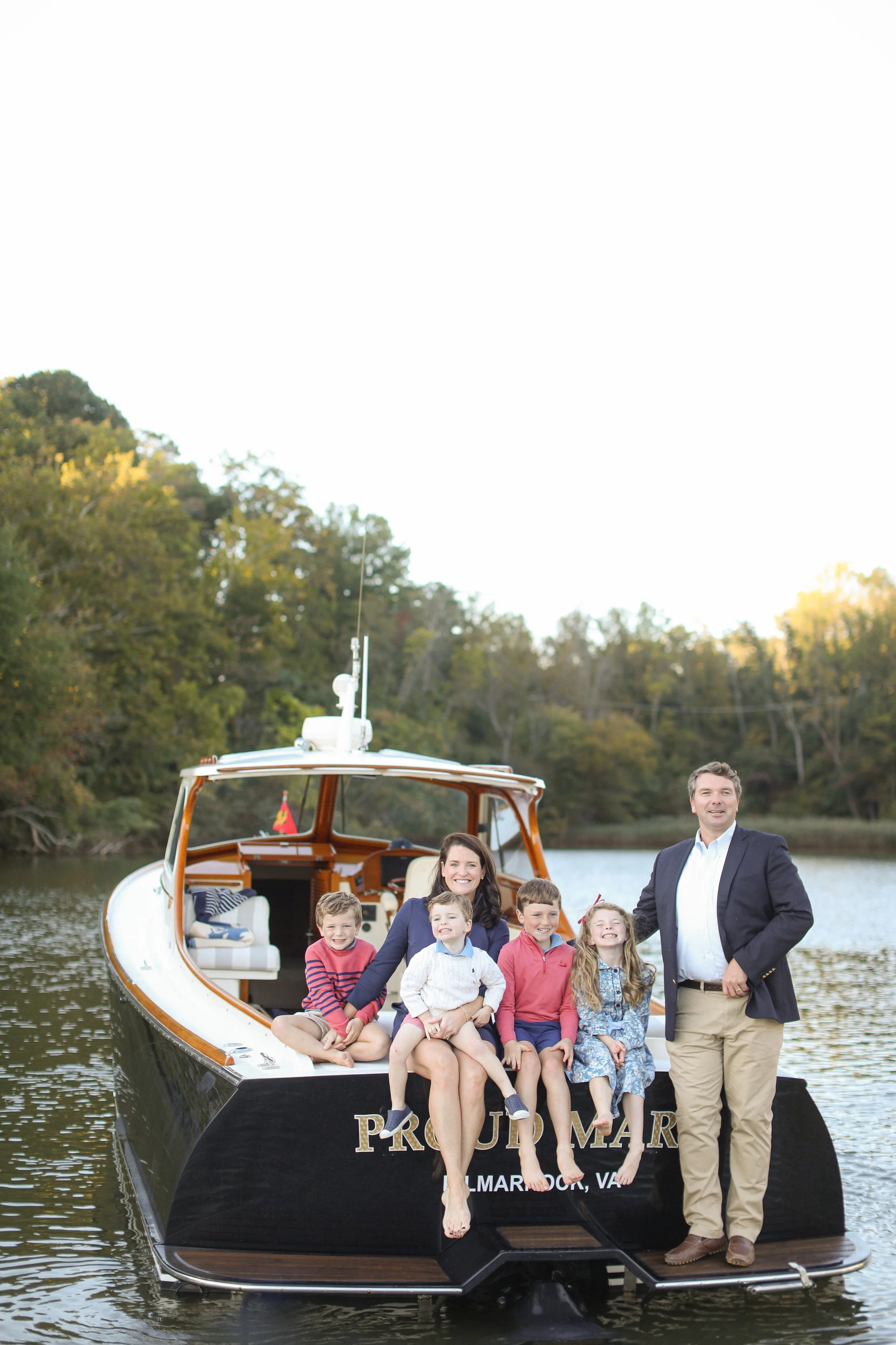 A family enjoying a luxury sunset charter aboard a Hinckley Picnic Boat with Chesapeake Classic Yacht Charters in Annapolis, MD 