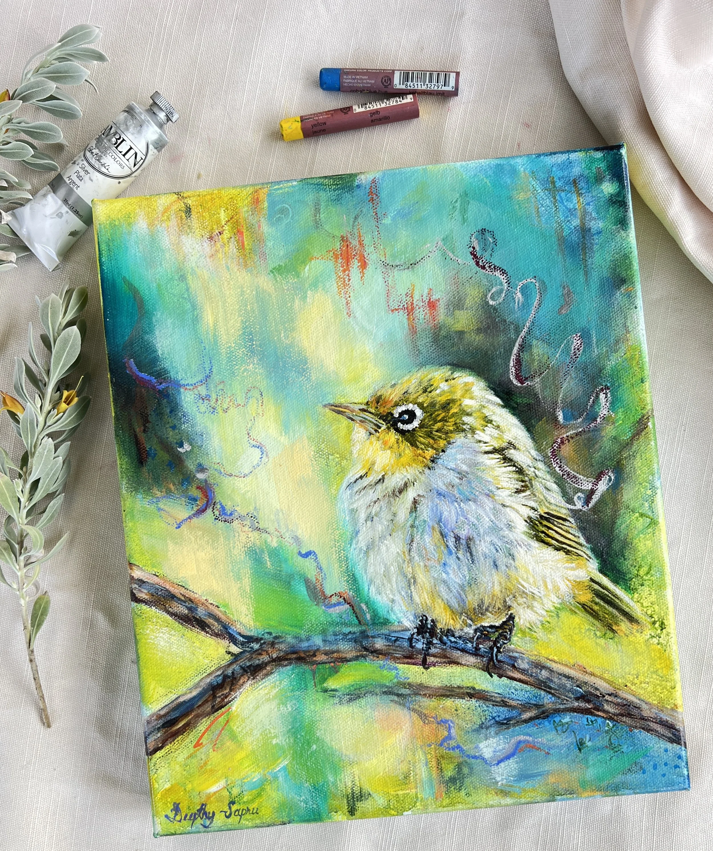 A colorful painting of an Australian Silvereye perched on a branch, with a background of blue, green, yellow, and blue background hues, surrounded by beautiful marks and splashes of silver.