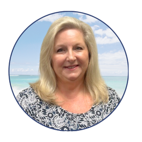 Professional headshot of Christina Johnson, loan officer at the SRCFCU Milton Branch, smiling in front of a soft beach background.