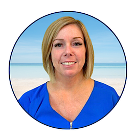 Professional headshot of Tammy Ward, loan officer at the SRCFCU Jay Branch, smiling in front of a soft beach background.