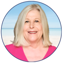 Professional headshot of Carla Hudson, loan officer at the SRCFCU Main Branch, smiling in front of a soft beach background.