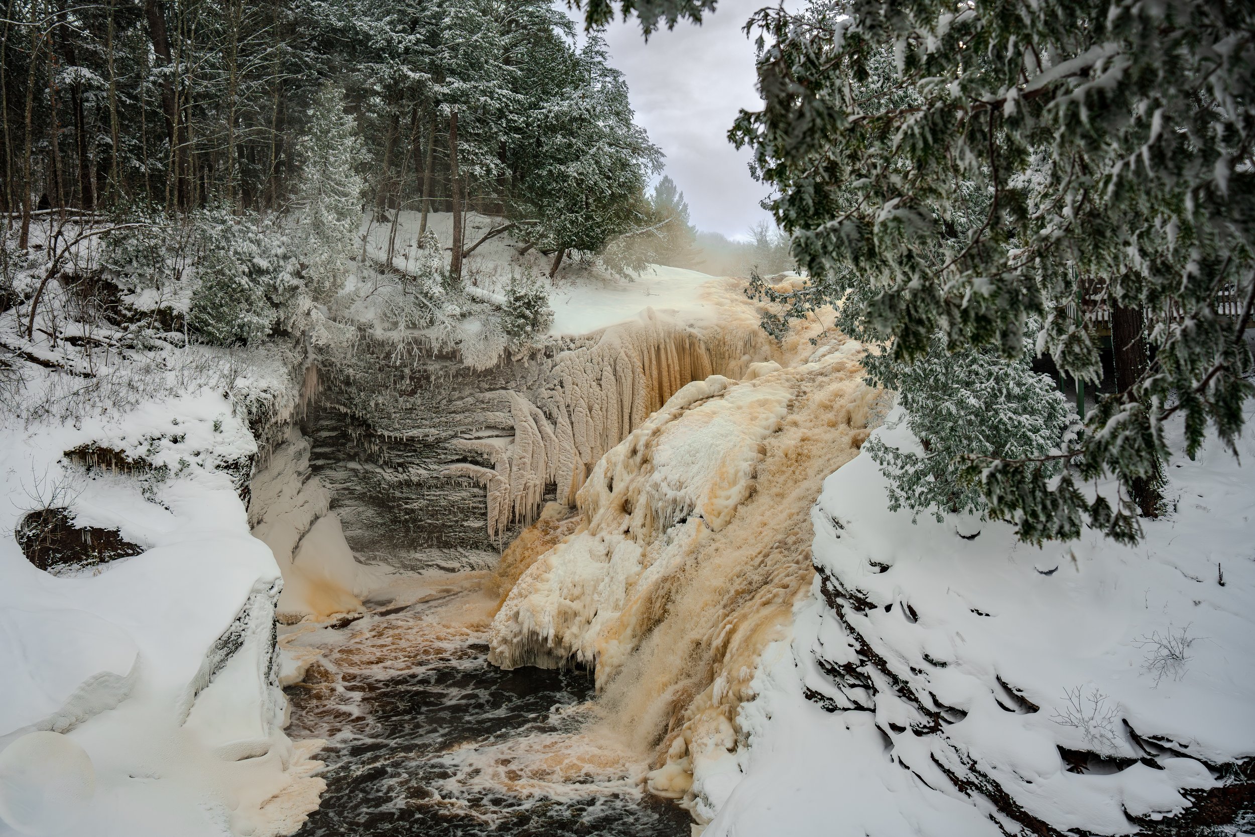 Nature photograph of Rainbow Falls captured during the winter. Waterfall Ice. UP Michigan.