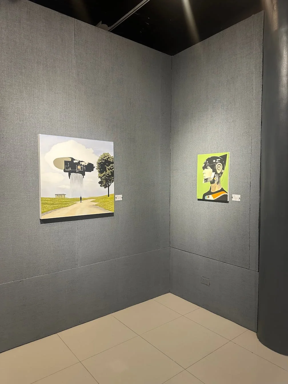 2 paintings of AADA at the corner of the exhibition