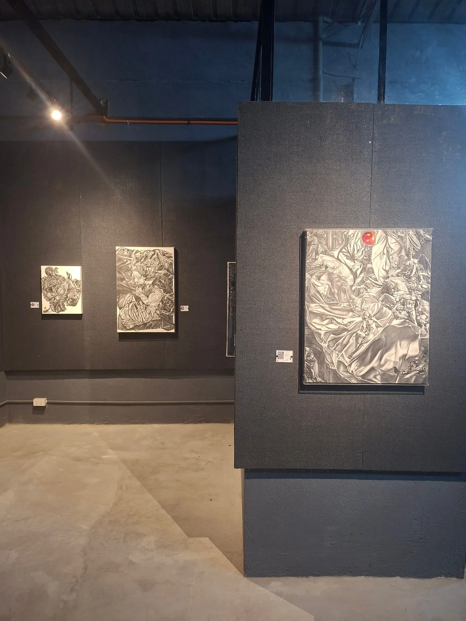 A corner view of bounce back exhibition showcasing three works by Reyna