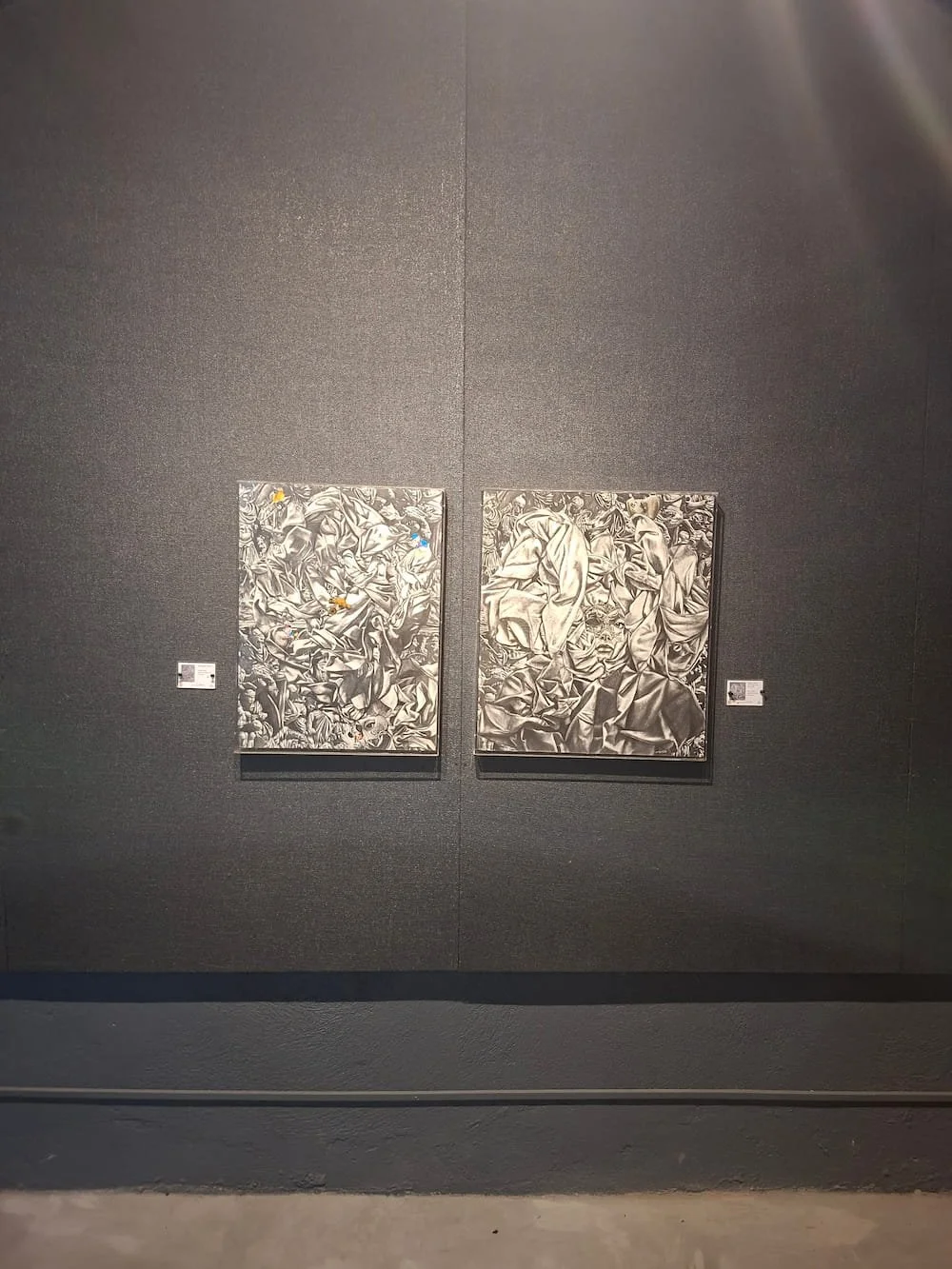 two paintings of reyna raymunda together at the bounce back exhibition