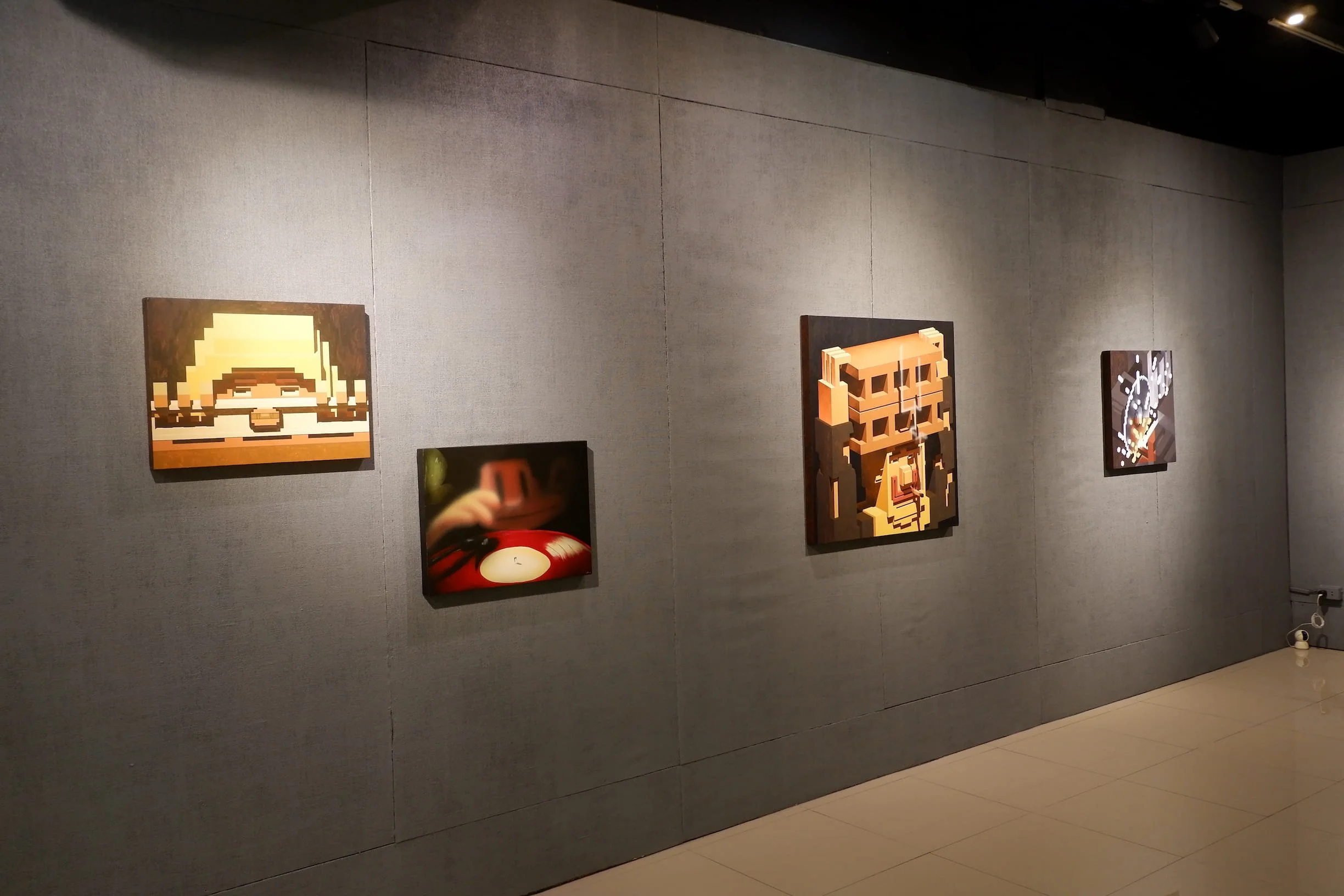 Art works of CHNO occupying the left wall of the exhibition