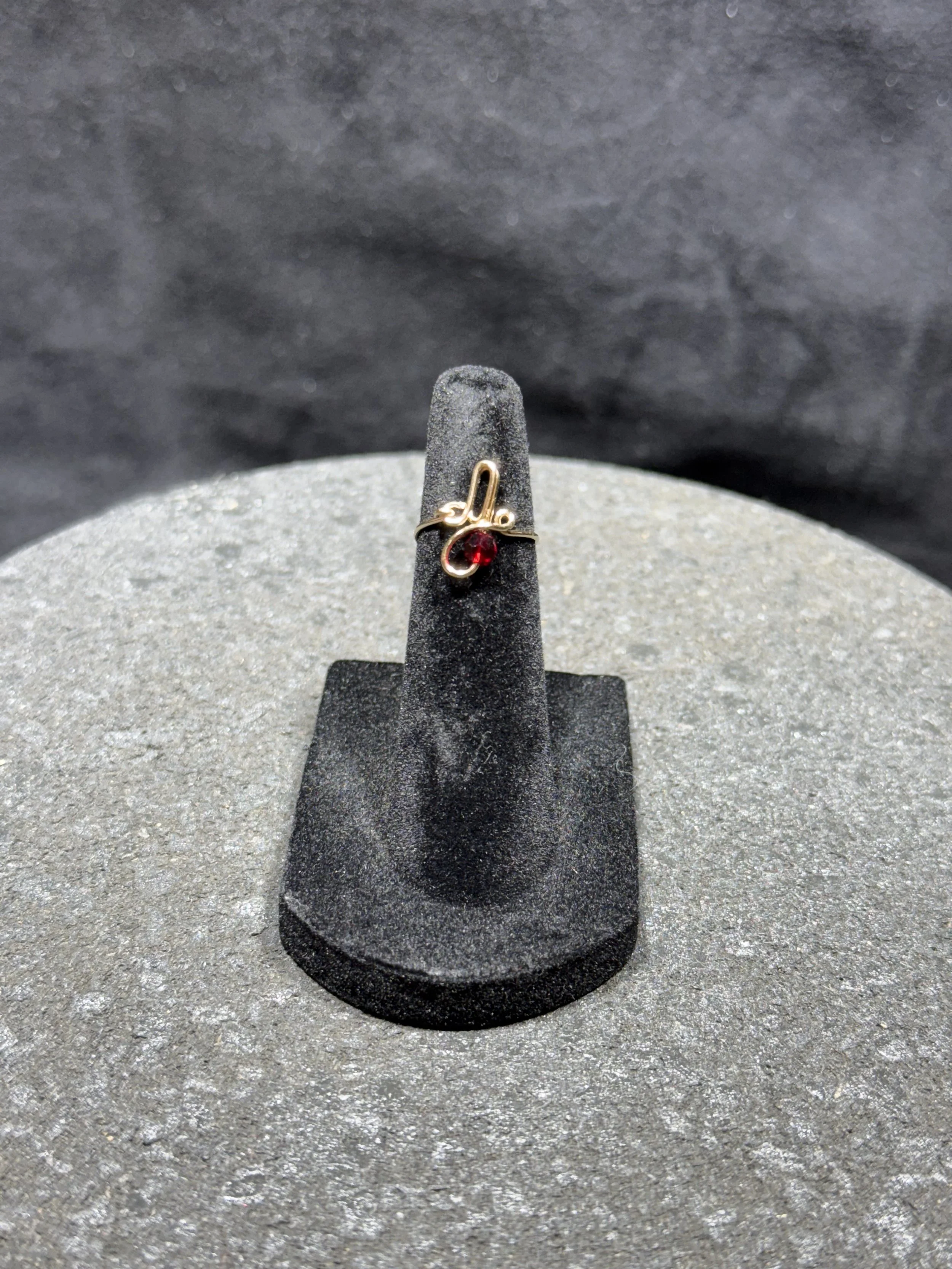 Personalized handmade wire jewelry ring with a custom name.