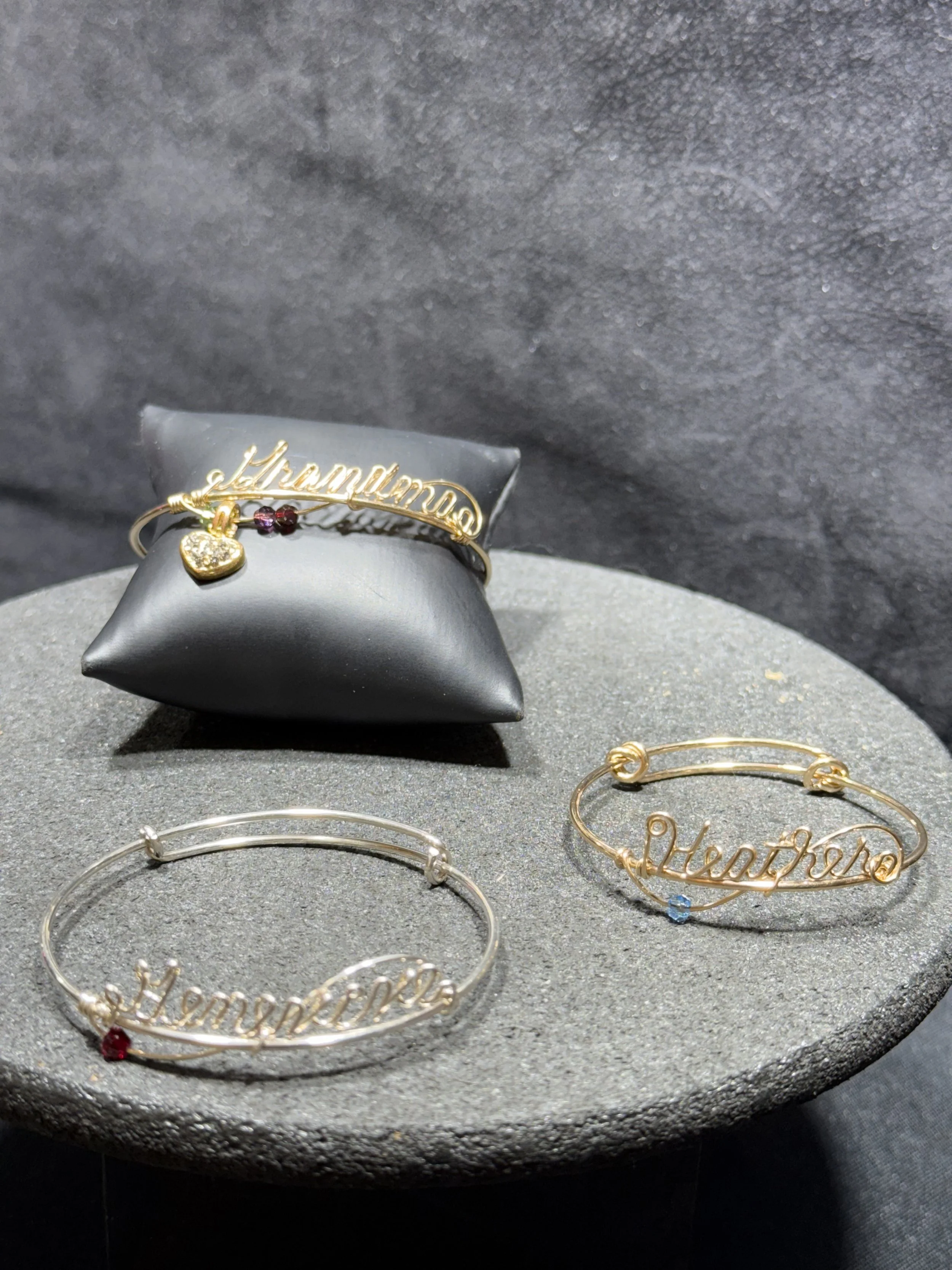 Custom wire bracelet designed for personalized names, initials, and charms.