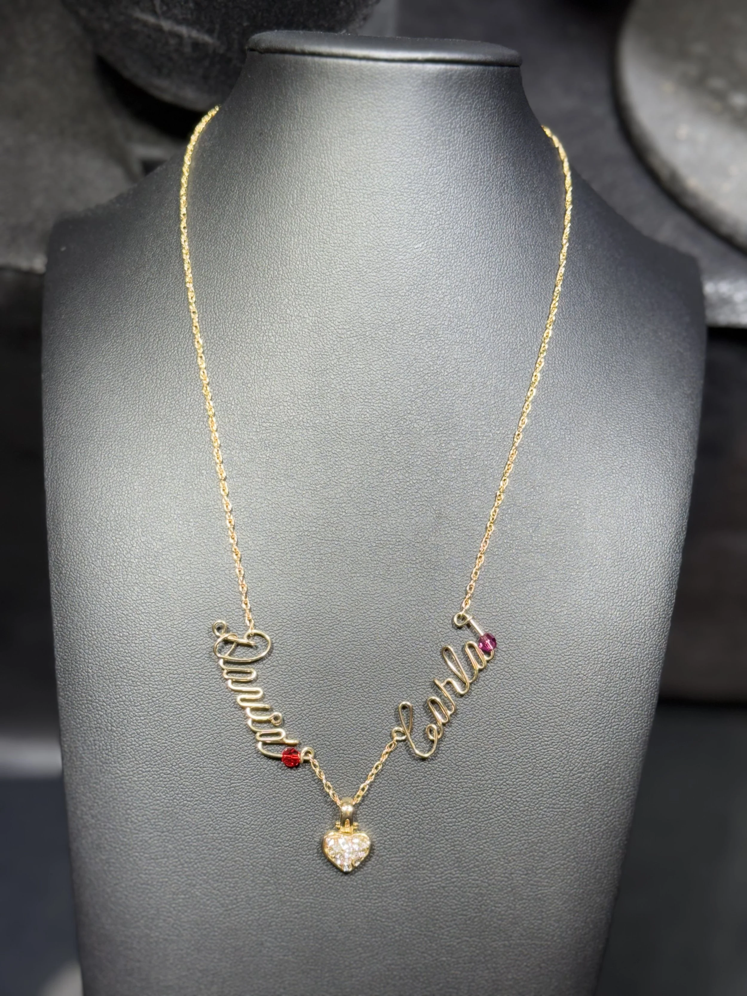 Handcrafted double name necklace with personalized wire lettering.