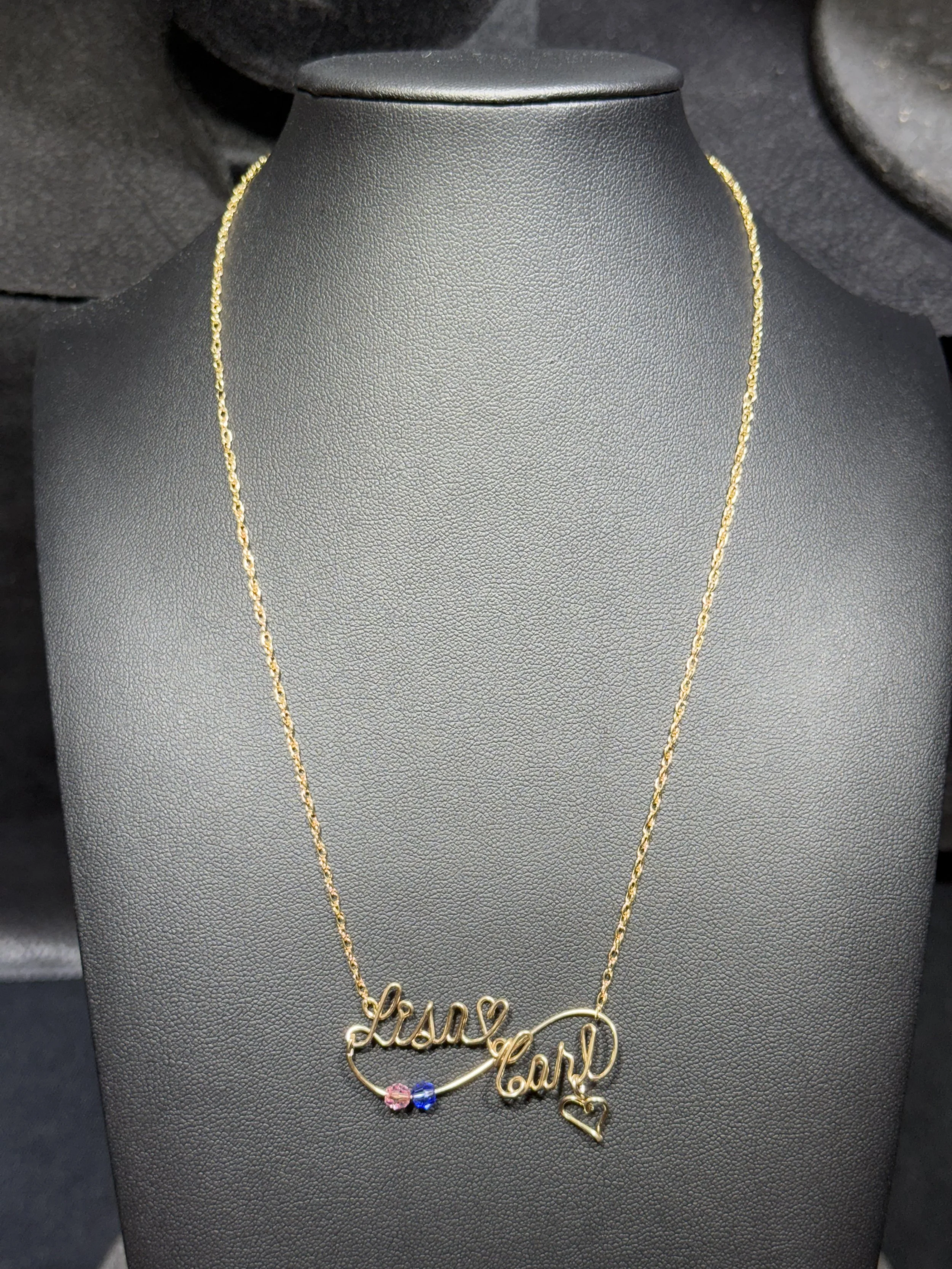 Custom wire jewelry necklace designed with personalized details and charms.