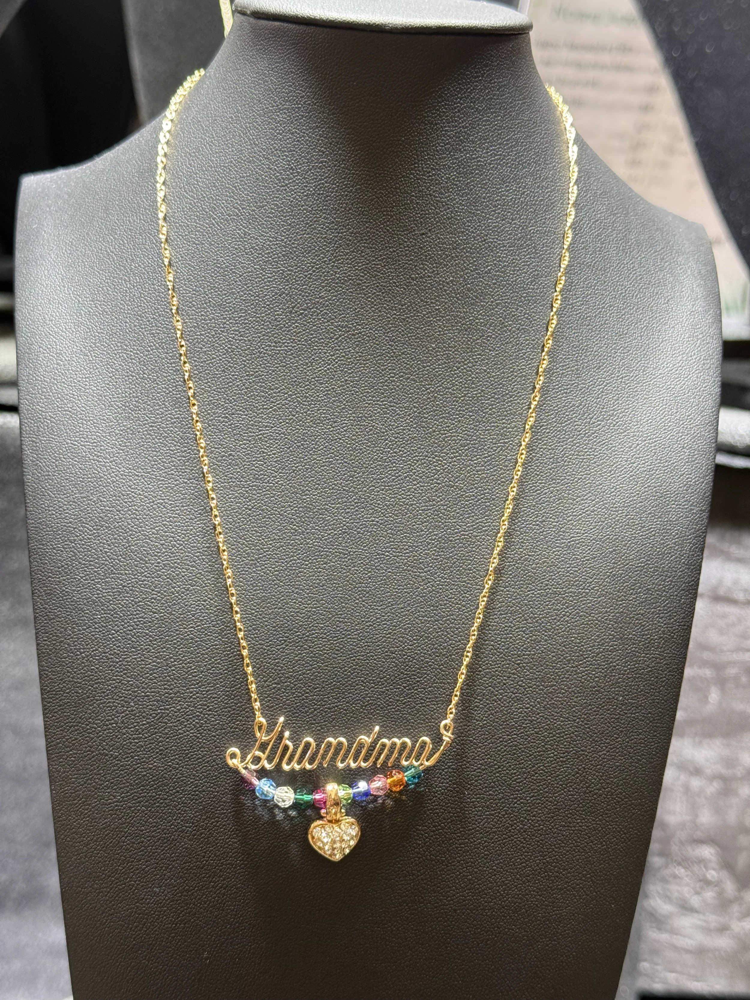 Custom wire jewelry necklace designed with personalized details and charms.