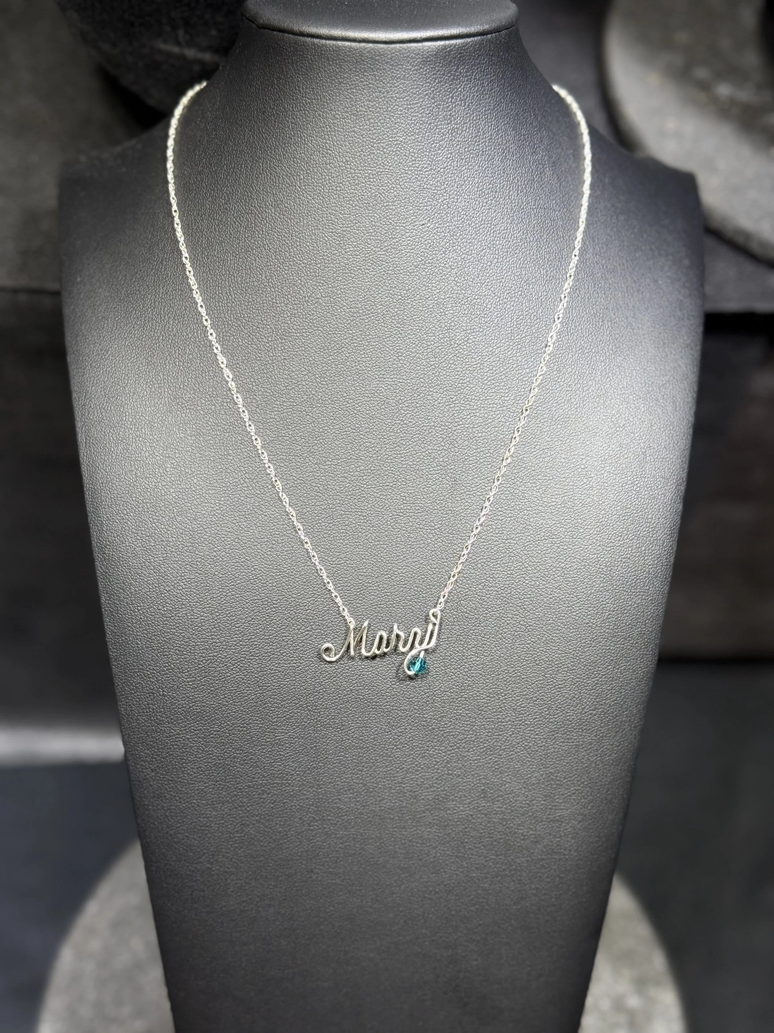 Handmade personalized wire necklace with customizable name options.