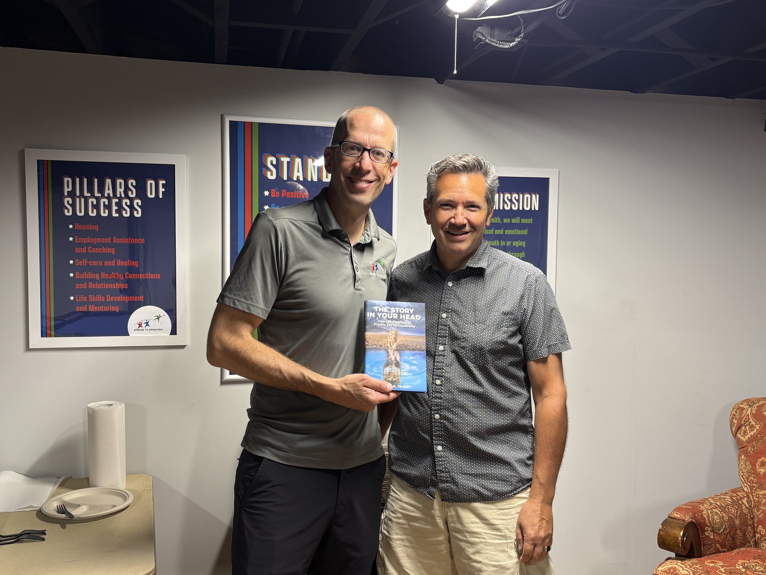 Bob presenting The Story In Your Head to Nick Sgarlata the Executive Director at Bridge To Brighter.