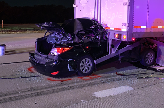 Diagram of a white pickup truck on an inclined plane showing forces like brake force, normal force, and brake force on axles with measurements.