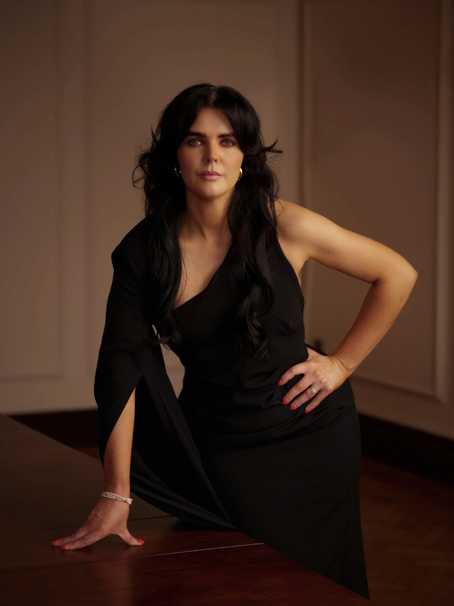 woman with black hair and black dress