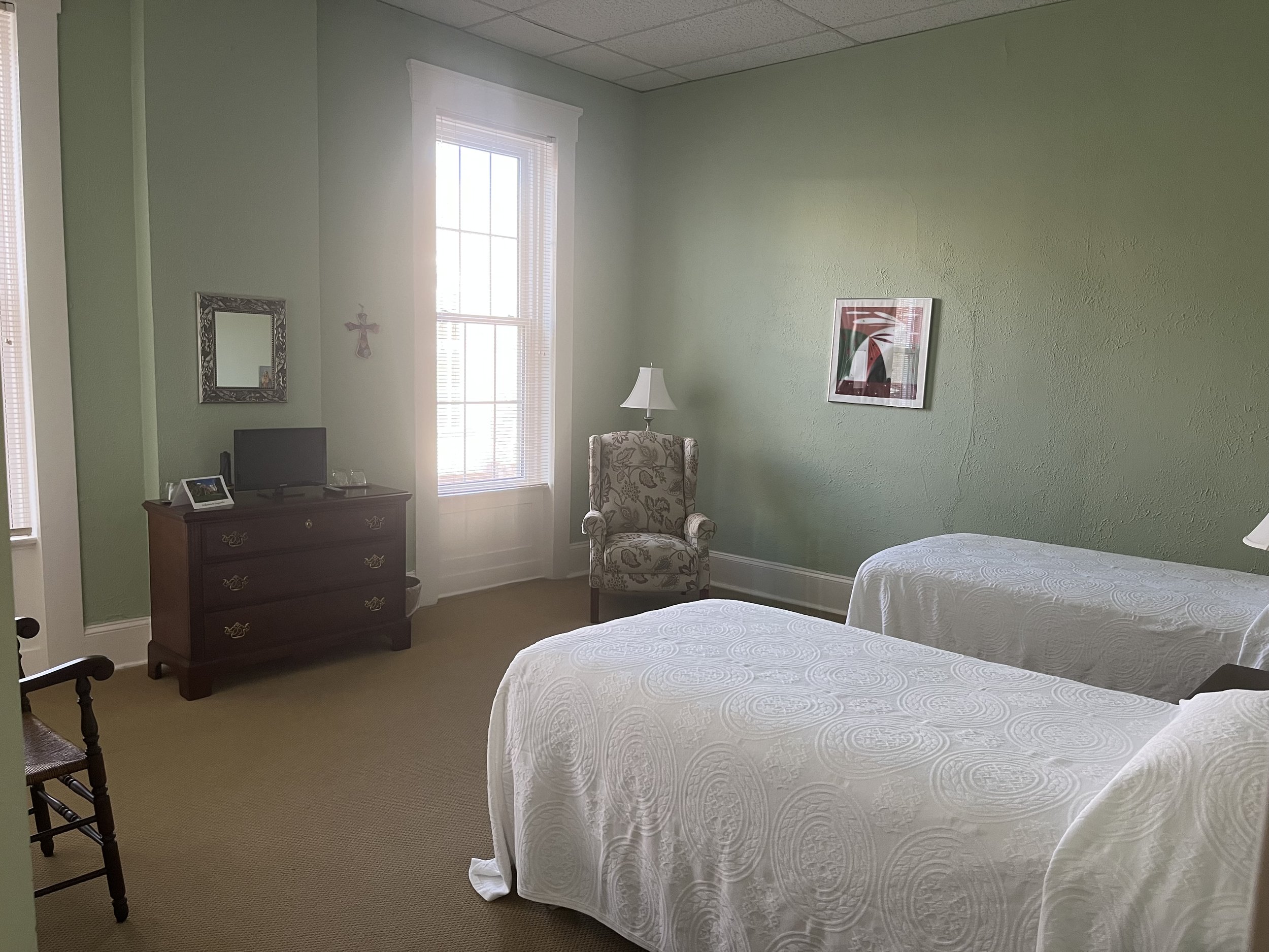 Accommodation in a shared room with 2 or 3 beds, and a bathroom in the room