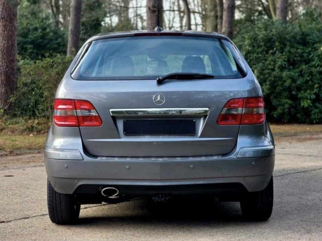 Side-by-side comparison of two vehicle interiors, showing the front seats with the driver's side on the left and the rear seats on the right. The vehicle on the left has two front seats, a dashboard, and a steering wheel, while the vehicle on the right has a back bench seat with three headrests.