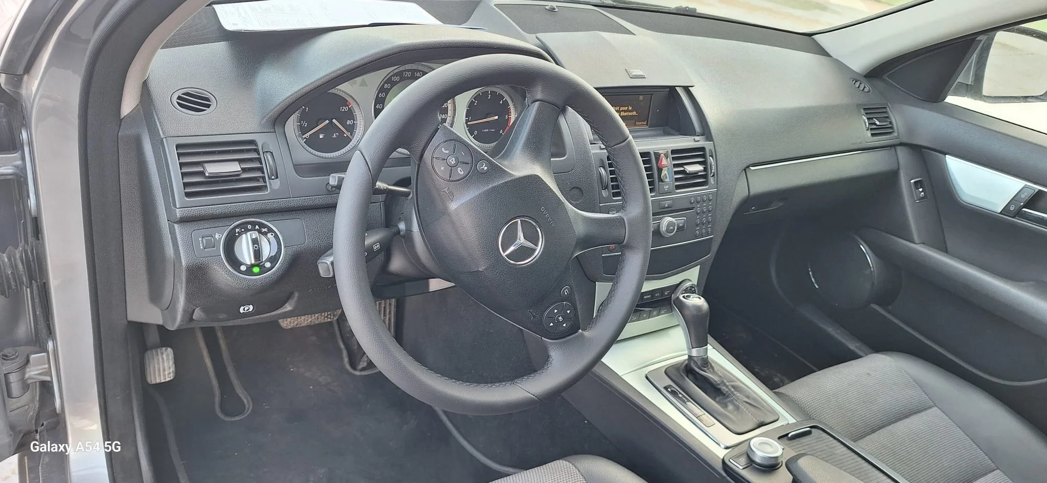 Side-by-side comparison of two vehicle interiors, showing the front seats with the driver's side on the left and the rear seats on the right. The vehicle on the left has two front seats, a dashboard, and a steering wheel, while the vehicle on the right has a back bench seat with three headrests.