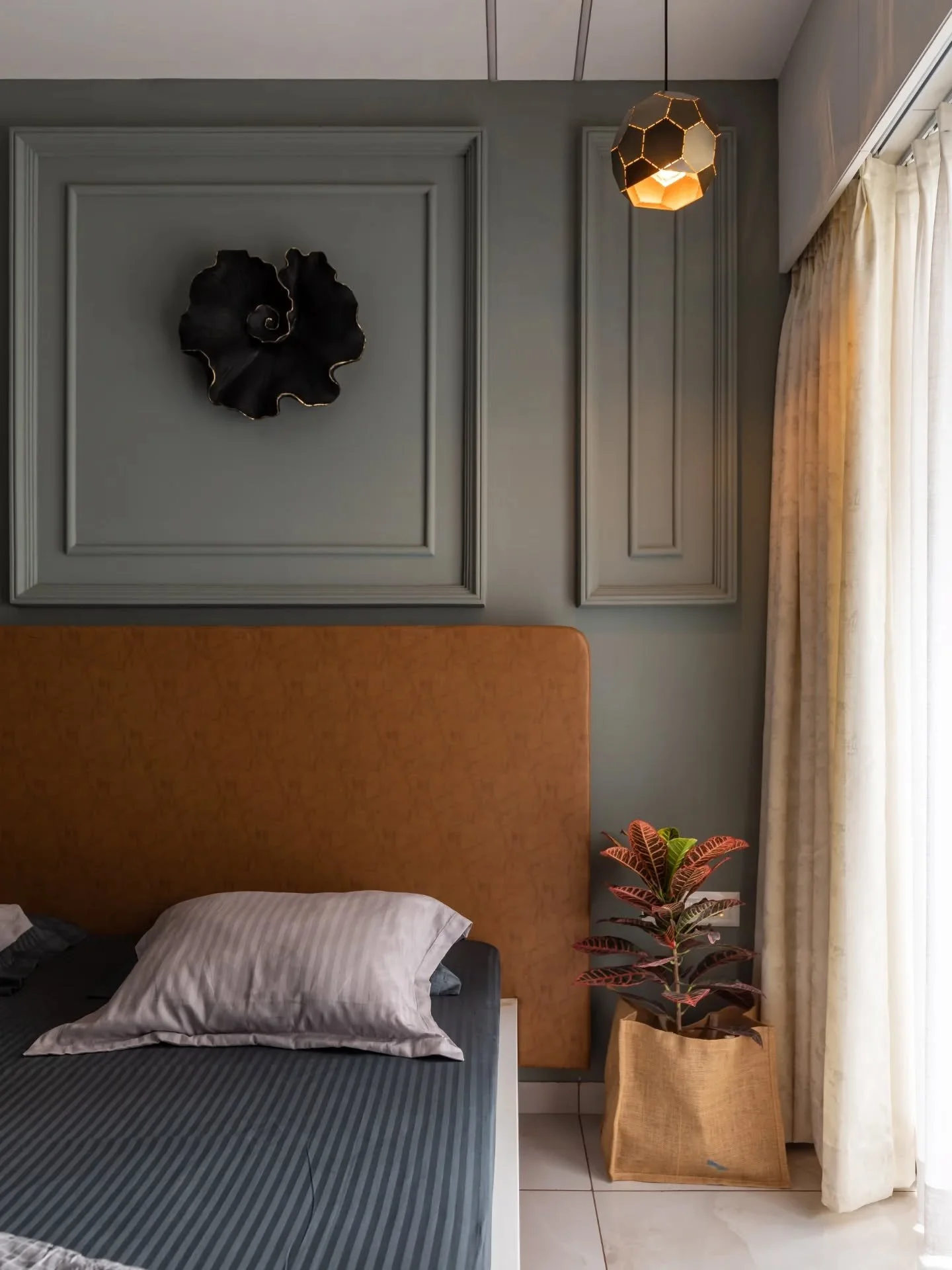 Some spaces feel effortless from the second you step in. Here, colours speak in measured notes &mdash; a teal sofa beside tan warmth, a dining set that keeps the room breathing, and a kitchen lifted by a pop of orange at the counter. The bedrooms sta