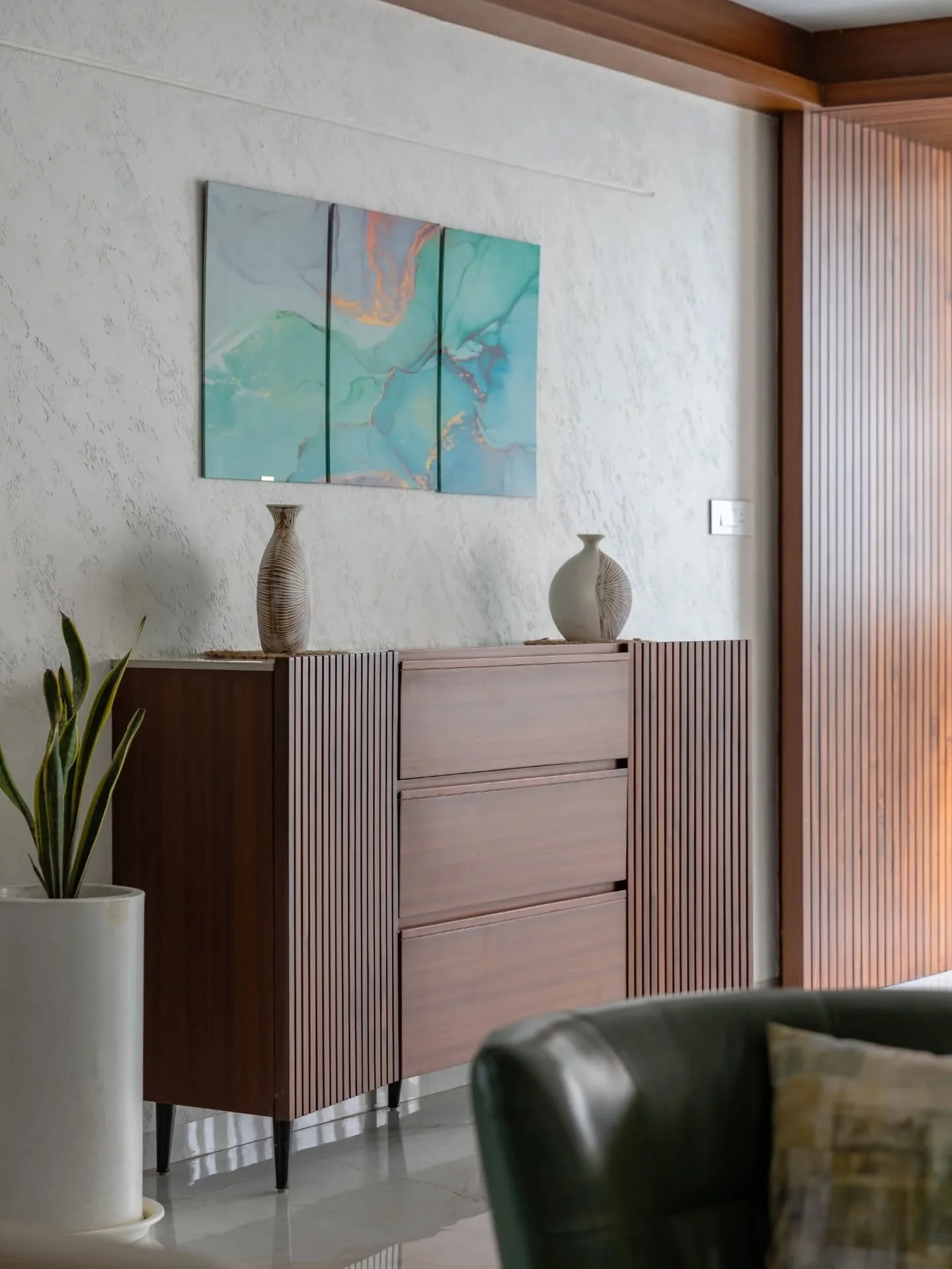 There&rsquo;s a certain ease built into this house. Air moves freely, rooms borrow light from the outdoors, and materials stay honest. Wood details bring texture, white walls amplify space, and powder-blue accents add just enough personality. The sea