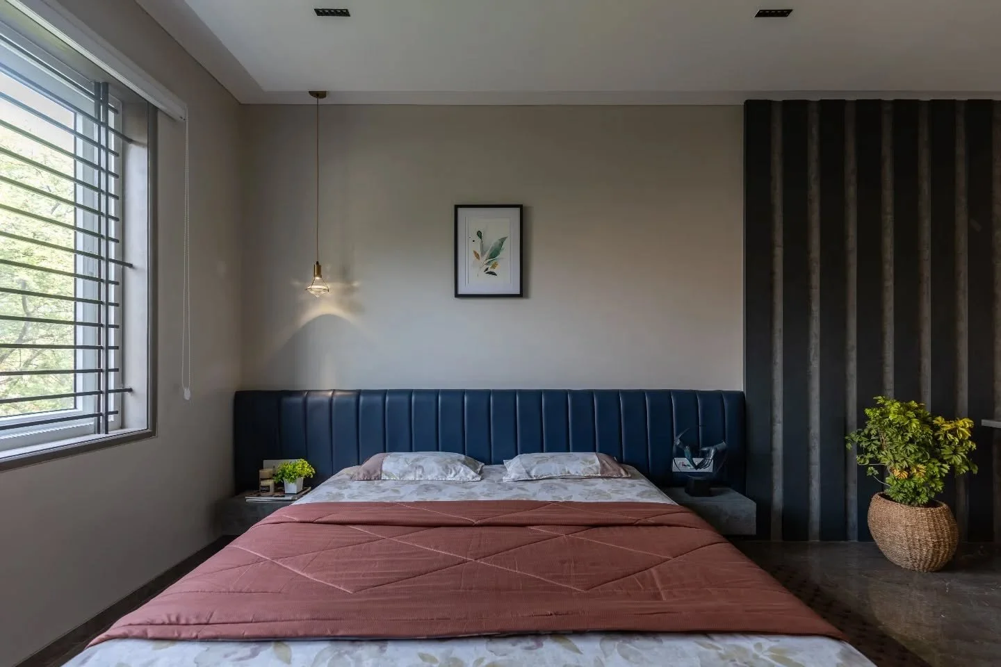 The bedrooms choose softness over spectacle. Cream backdrops keep things restful, while headboards bring personality&mdash;blue, grey, indigo, rust&mdash;each one distinct, never loud. Small seating and work corners slip into place naturally, making 