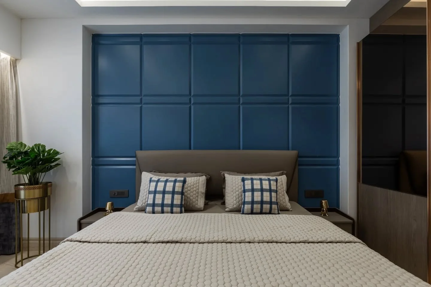 The bedrooms shift the tone without breaking the rhythm&mdash;one breezy in blue and white, light on its feet, the other deeper in rose gold and beige, where panelling and mirrored surfaces add weight and polish, next engulfed in patterns and last a 