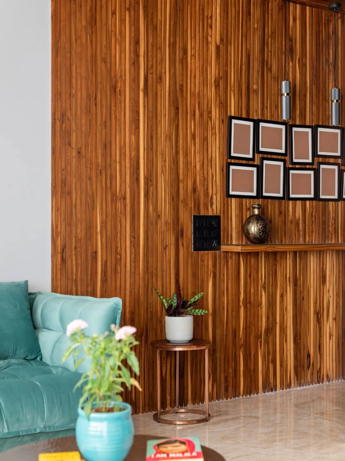 Look closely and the artwork does most of the talking &mdash; printed frames at the entry, 3D monochrome pieces lining grey walls, bold indigo accents, and a scenic panel that quietly transforms a child&rsquo;s room. Even the swing and teal bench fee