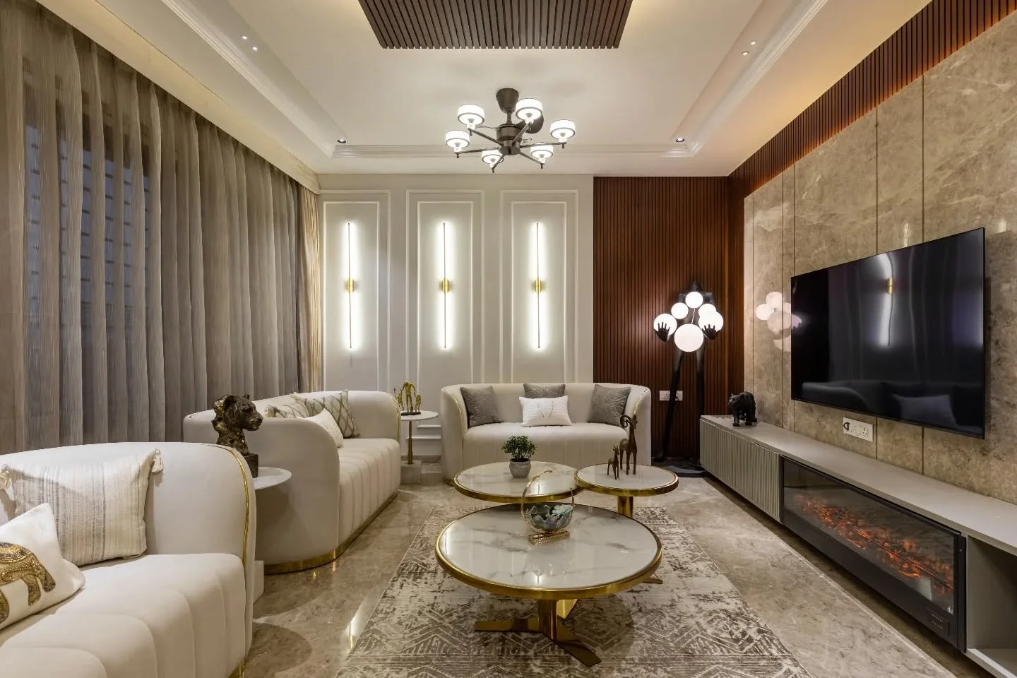 Luxury here isn&rsquo;t about spectacle; it&rsquo;s about consistency. Cream envelopes the living room, layered with marble, wood and fine gold accents that catch light without overpowering it. The dining echoes the language with a diamond cut ceilin