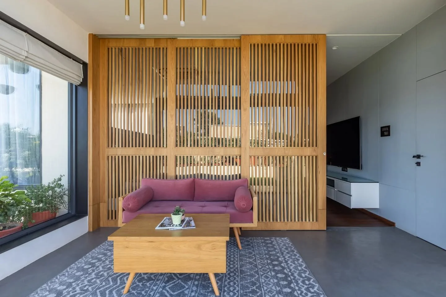 Two bedrooms, two moods, one shared luxury&mdash;light and landscape invited in without hesitation. One space plays with white, wood and a confident indigo wall, softened by a blush lounger facing the lawn. The other settles into sky blue calm with t