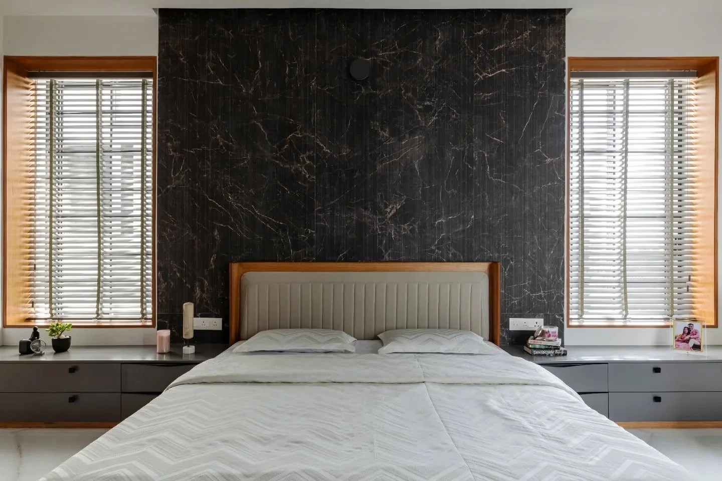 The bedrooms take the base language and gently push it in different directions. One introduces colour, another plays with finish, a third leans into texture or panelling. They stay related, but never identical&mdash;each room holding its own identity