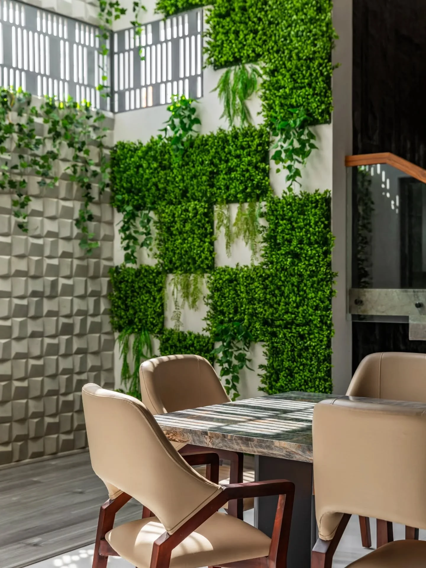 What stays with you are the quieter gestures&mdash;planters tucked into corners, rugs marking out small territories, cane weaving its way into furniture, and greenery climbing where you don&rsquo;t expect it. Even the pooja space sits comfortably wit