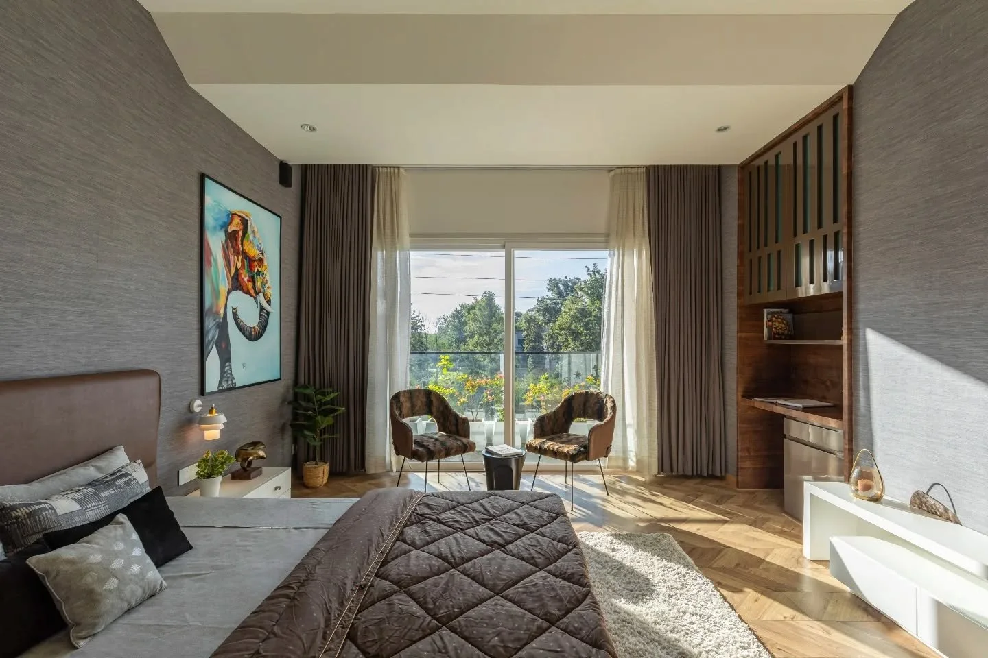 The bedrooms take a different approach altogether&mdash;less about making an impression and more about creating a feeling. Timber flooring lends warmth underfoot, muted palettes keep the atmosphere relaxed, and carefully placed artwork, curios, and p